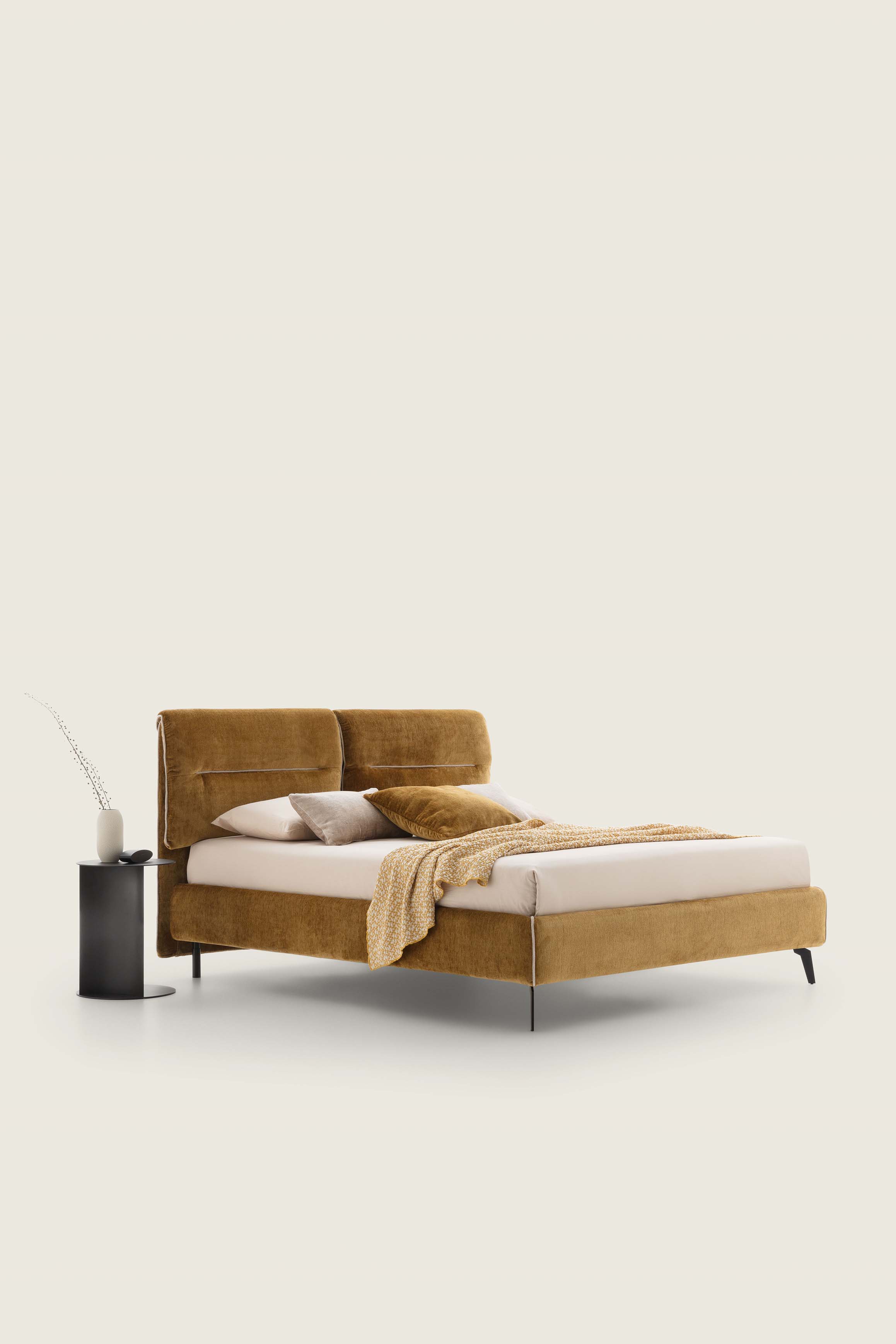 Bed with brown velvet-like texil upholstery