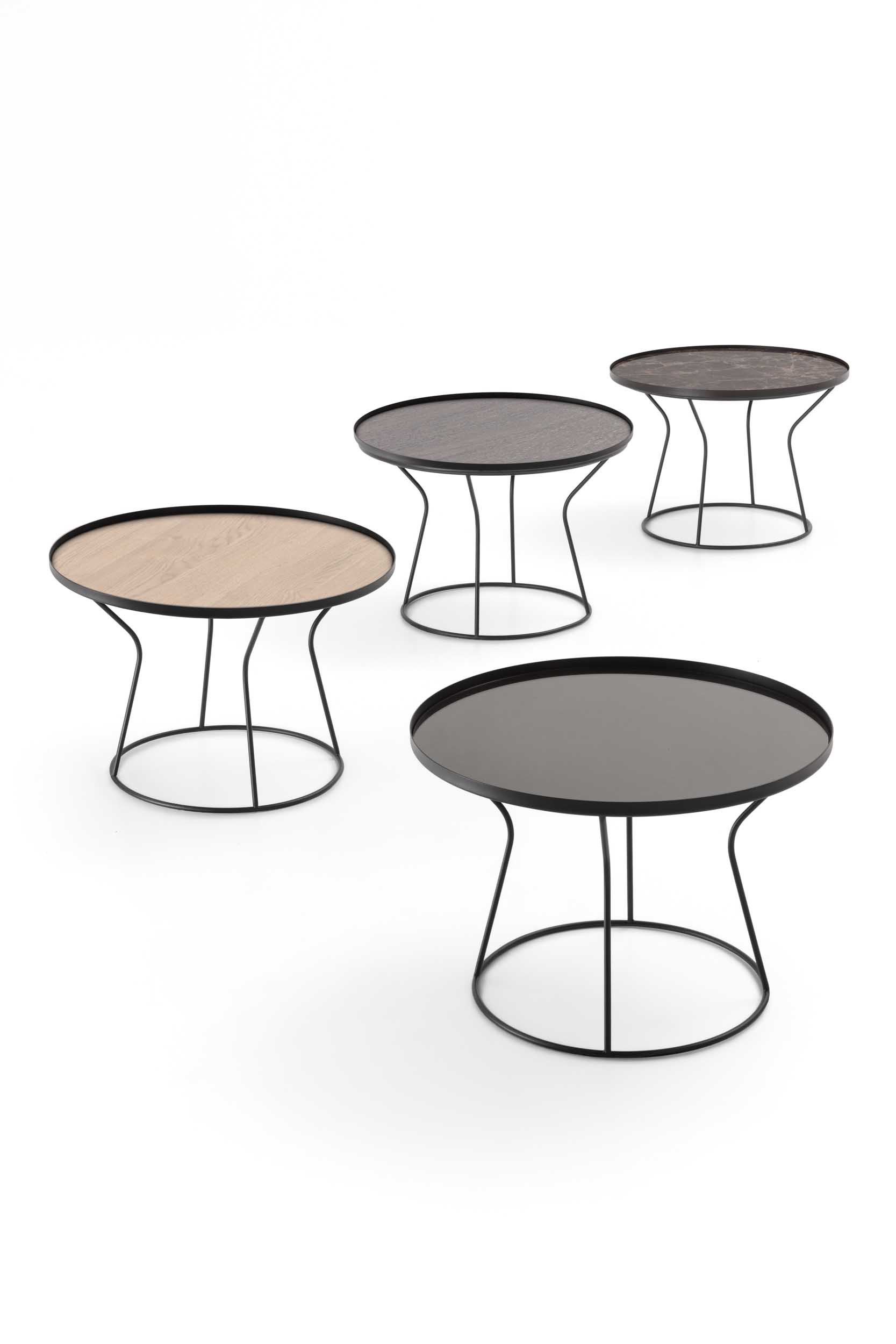 Large round tables with various top types and slim metal structures.