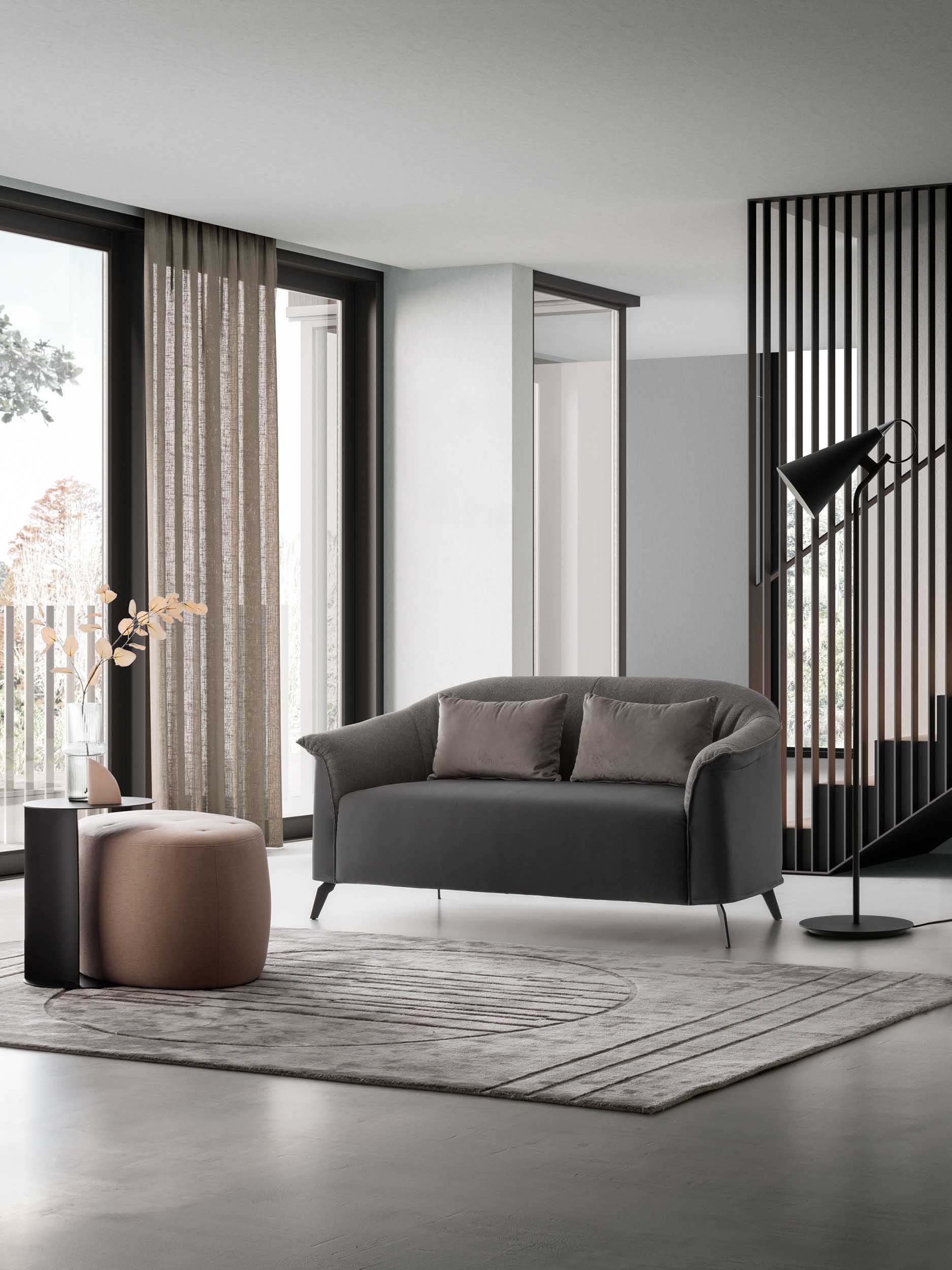 Designer loveseat with two cushions in a bright modern living room