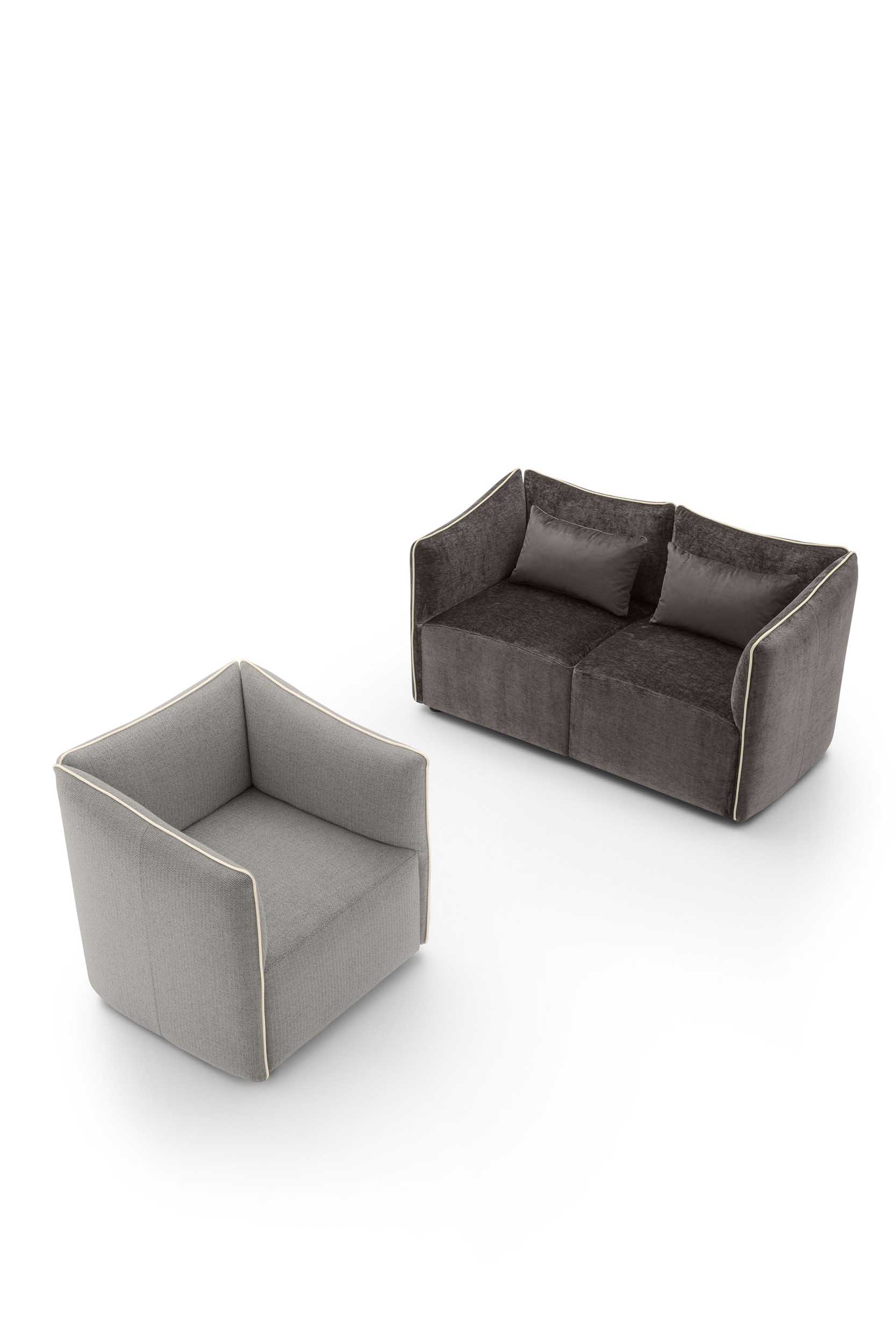 Dark gray two-seater loveseat with contrasting perimeter piping