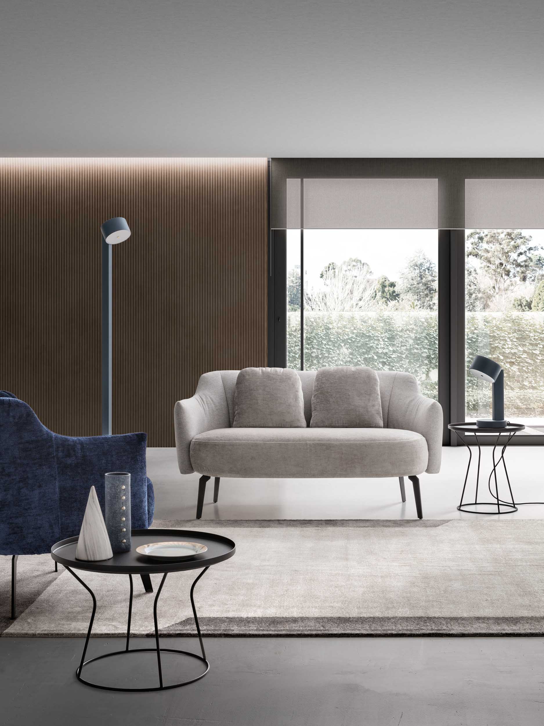 Light-colored two-seater loveseat on a geometric rug