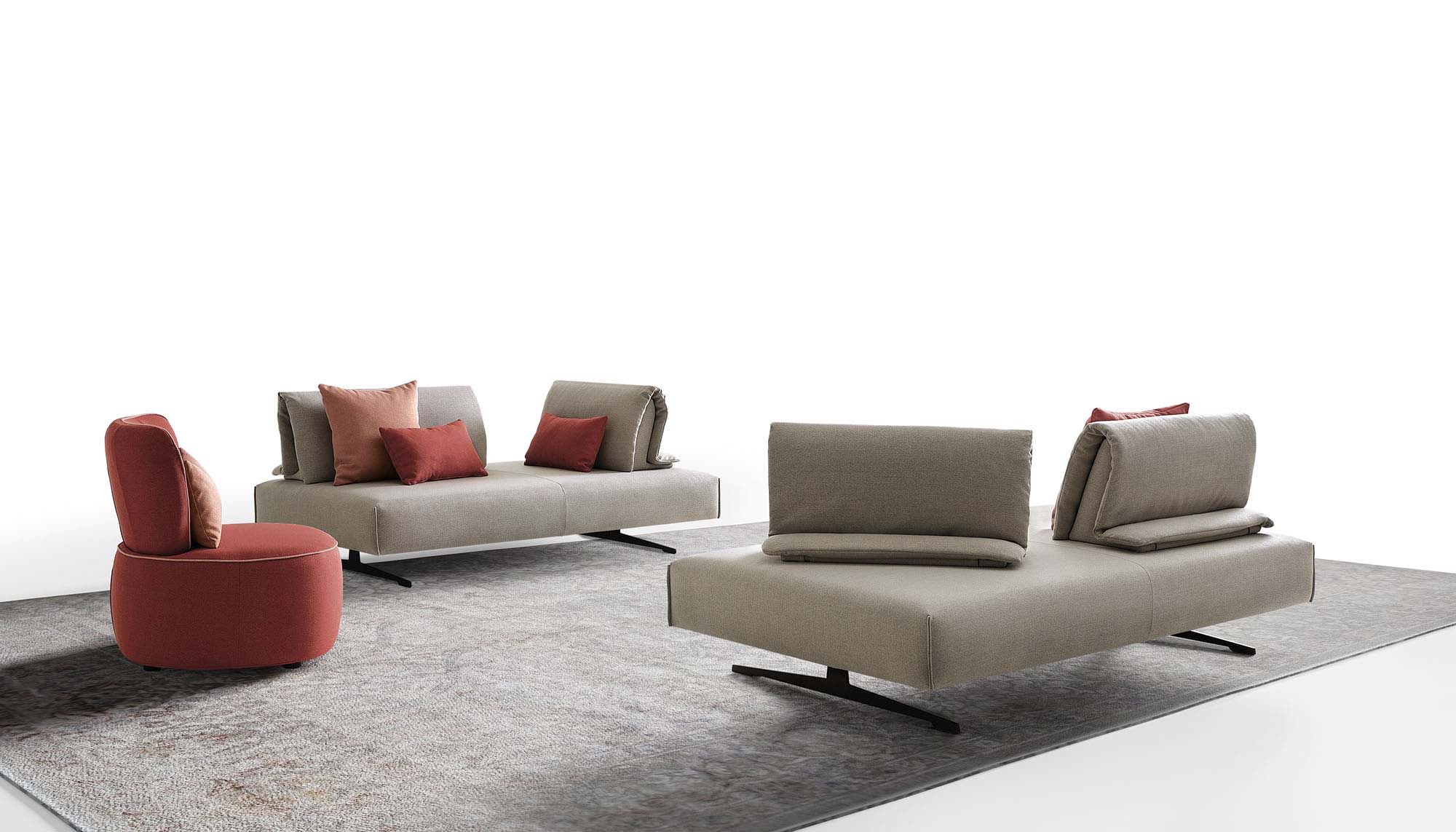 Modular grey and red sofa with sliding backrests arranged as two islands