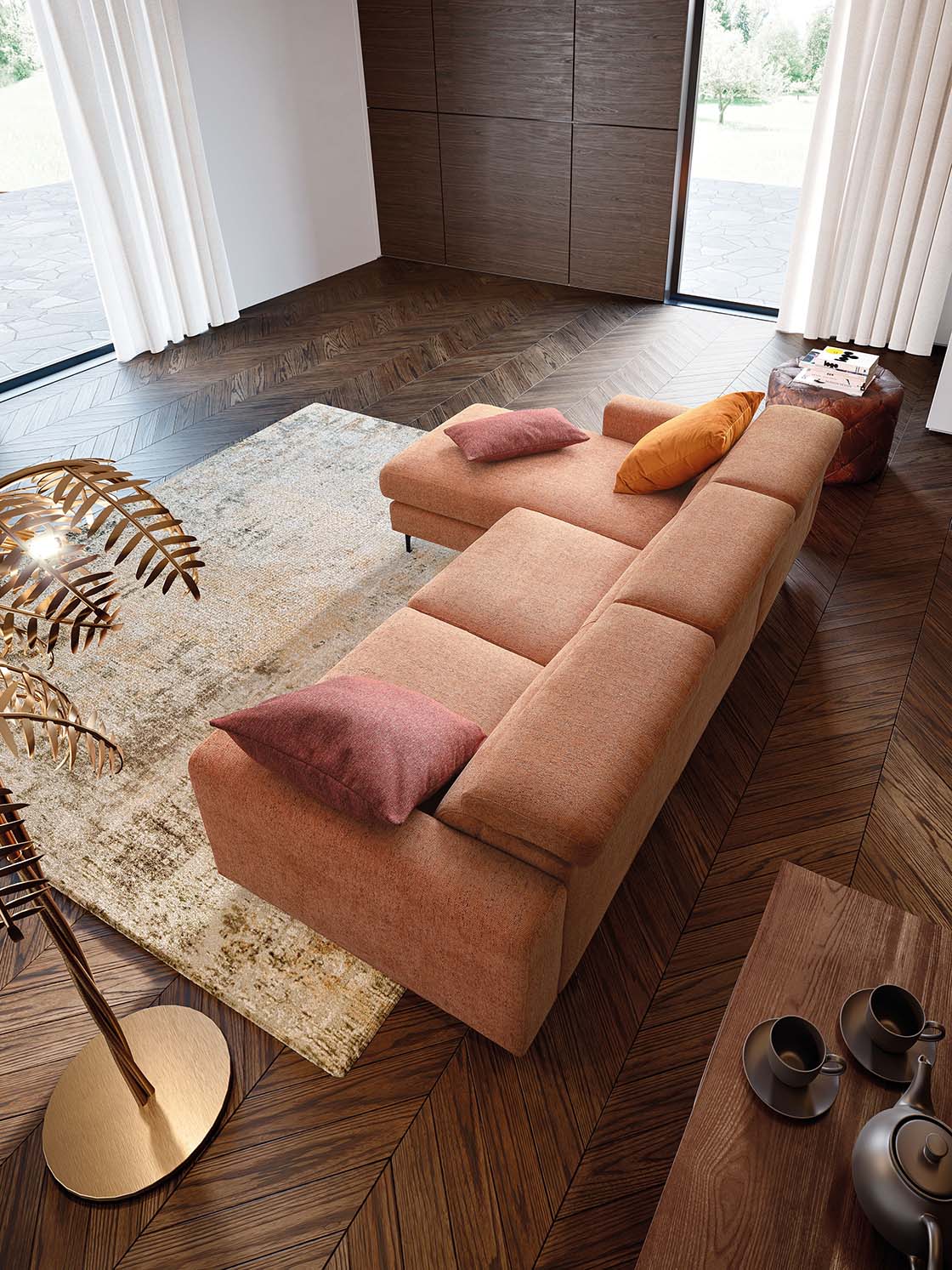 Modern sofa in orange fabric with red and orange cushions. Warm colors to liven up the environment