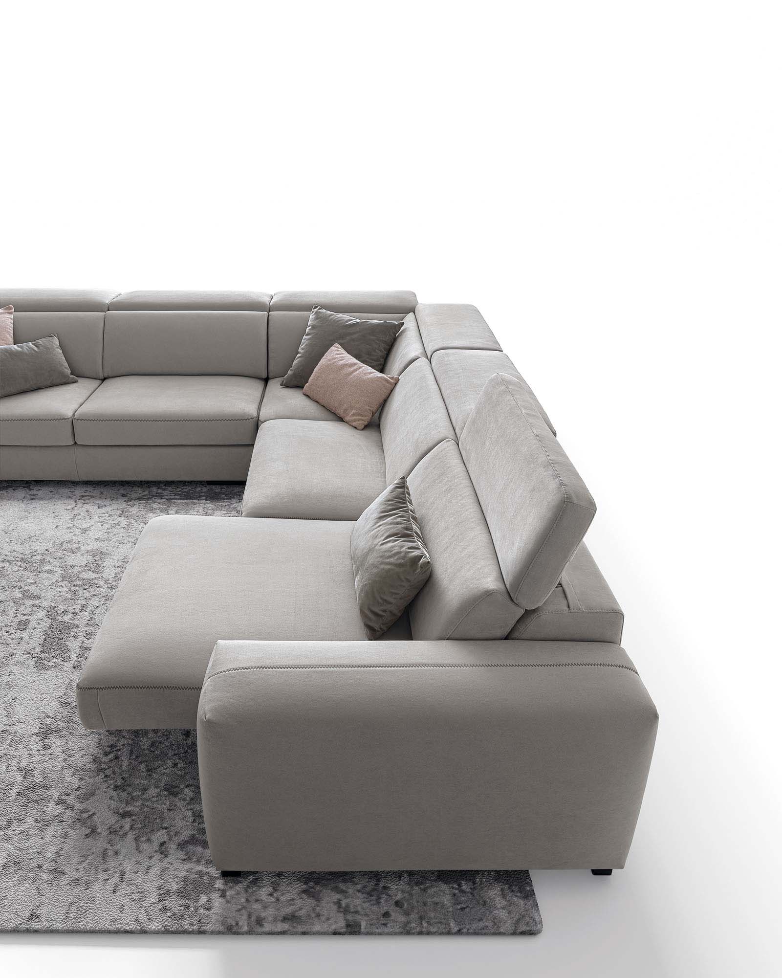 Light grey corner sofa with pull-out seats and adjustable headrests