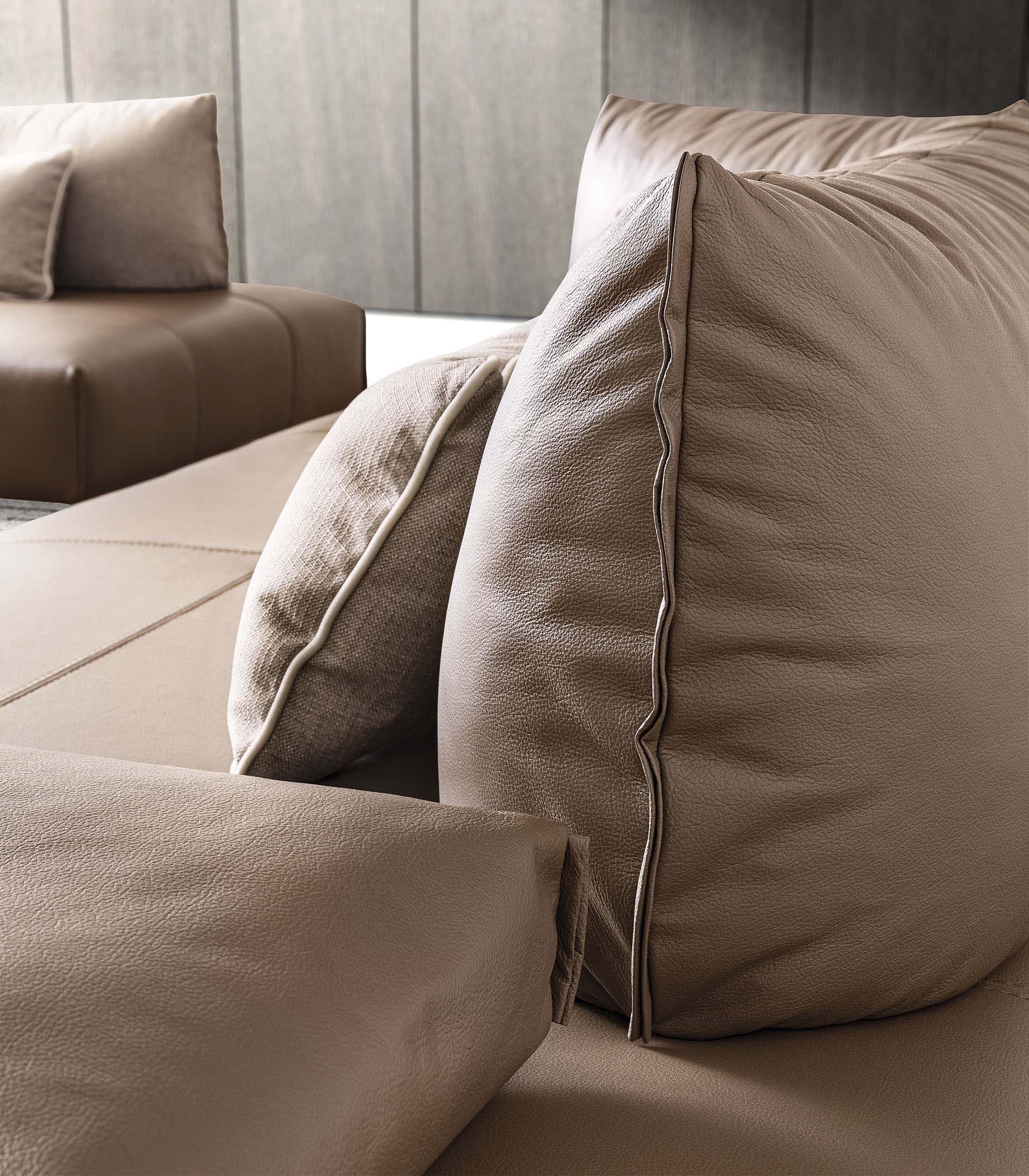 Detail of the cushion backrest of a brown leather sofa