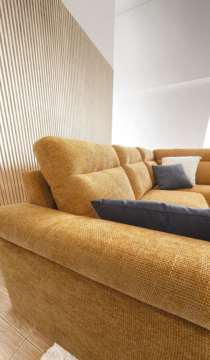 Detail of the high and soft backrest of a sofa, for optimal back support