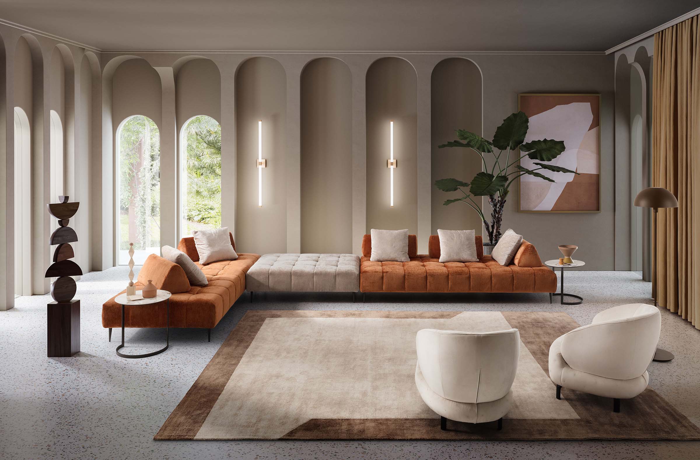 Modern living room furnished with a large and design Bowie sofa and two white armchairs