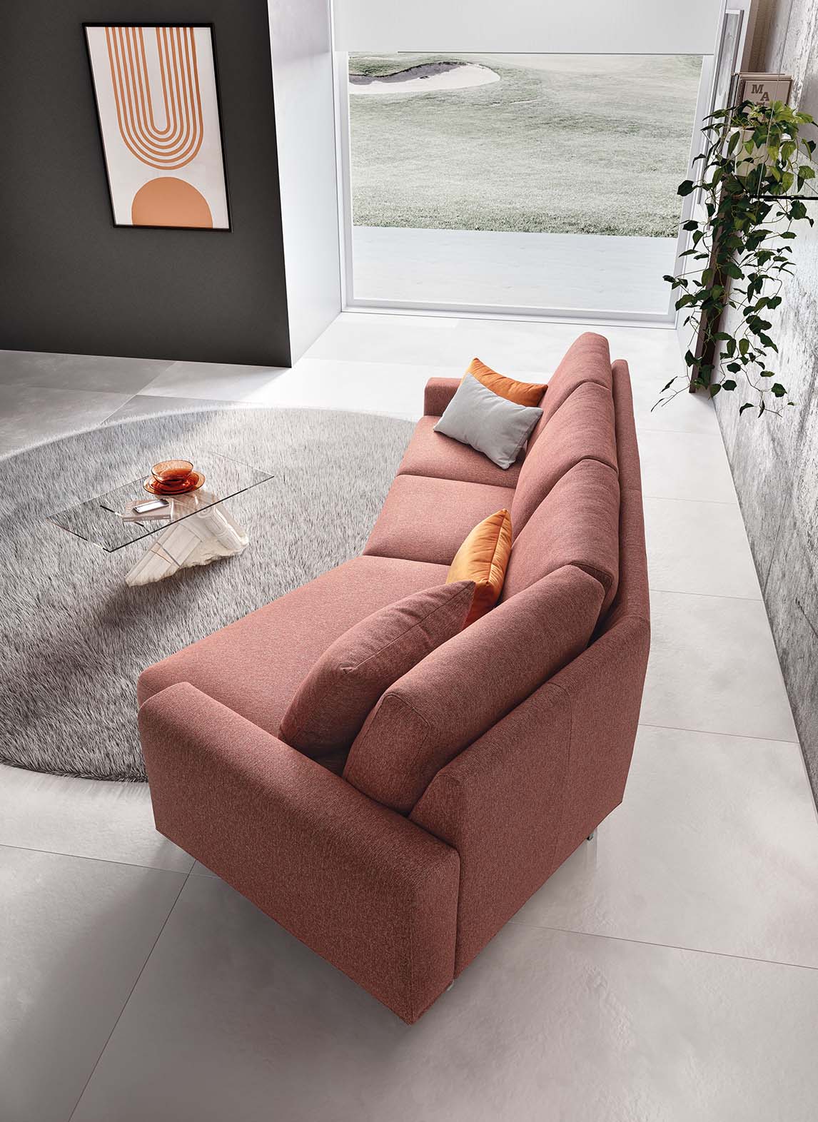 Top view of a red fabric sofa in a modern gray living room