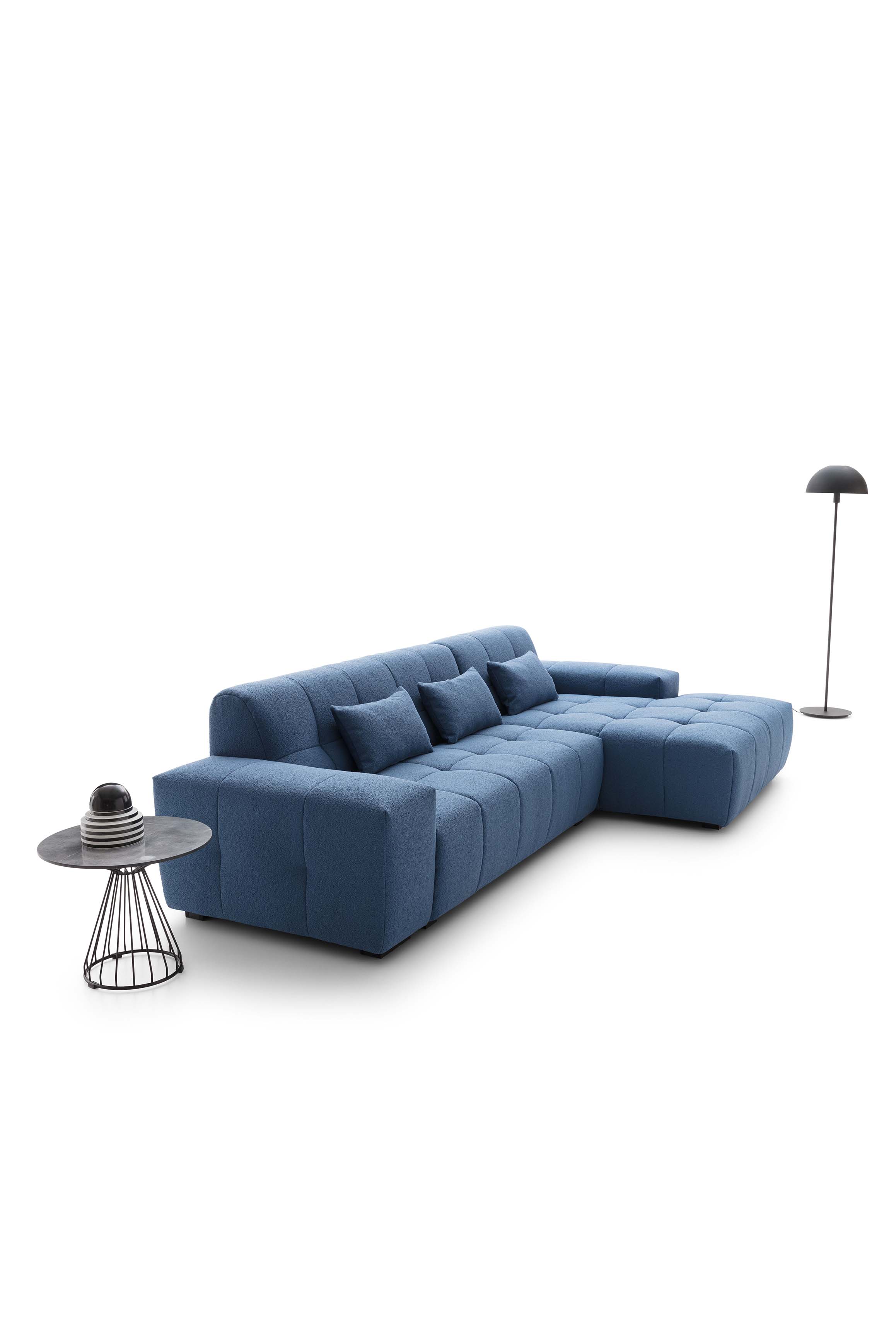 Soft and comfortable sofa with side chaise longue and quilted soft fabric upholstery