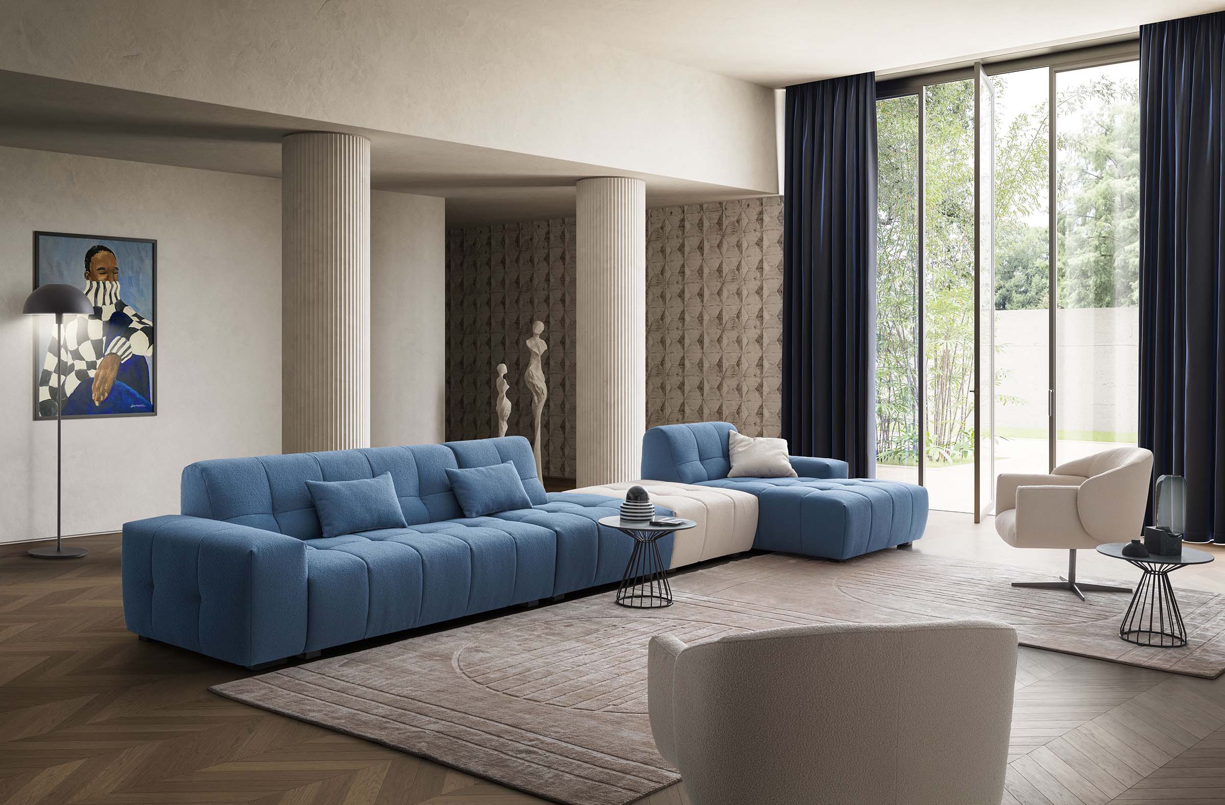 Living room furnished with Collins linear sofa with chaise longue and interchangeable modules and white designer armchairs. Light blue and cream colors