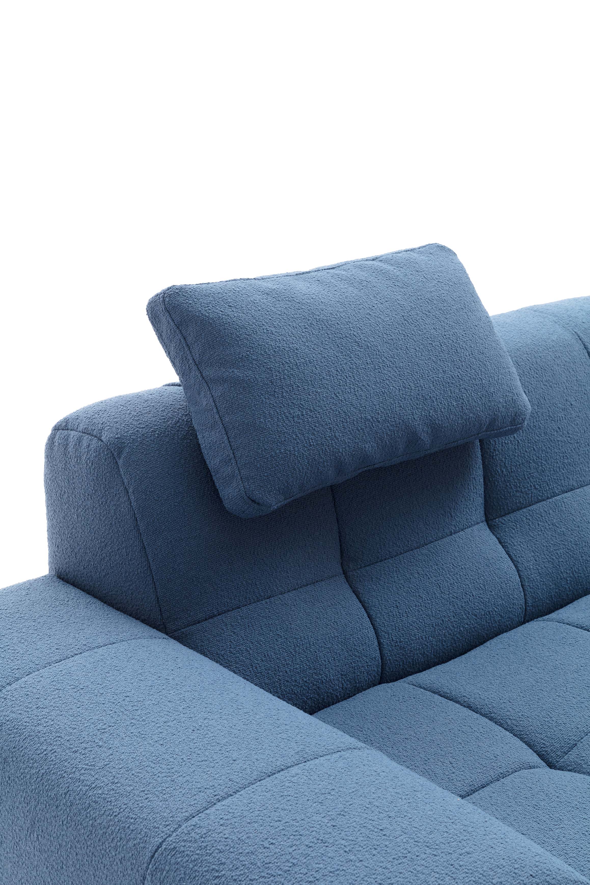 Headrest detail of a quilted sofa: a cushion attached to the backrest for maximum comfort