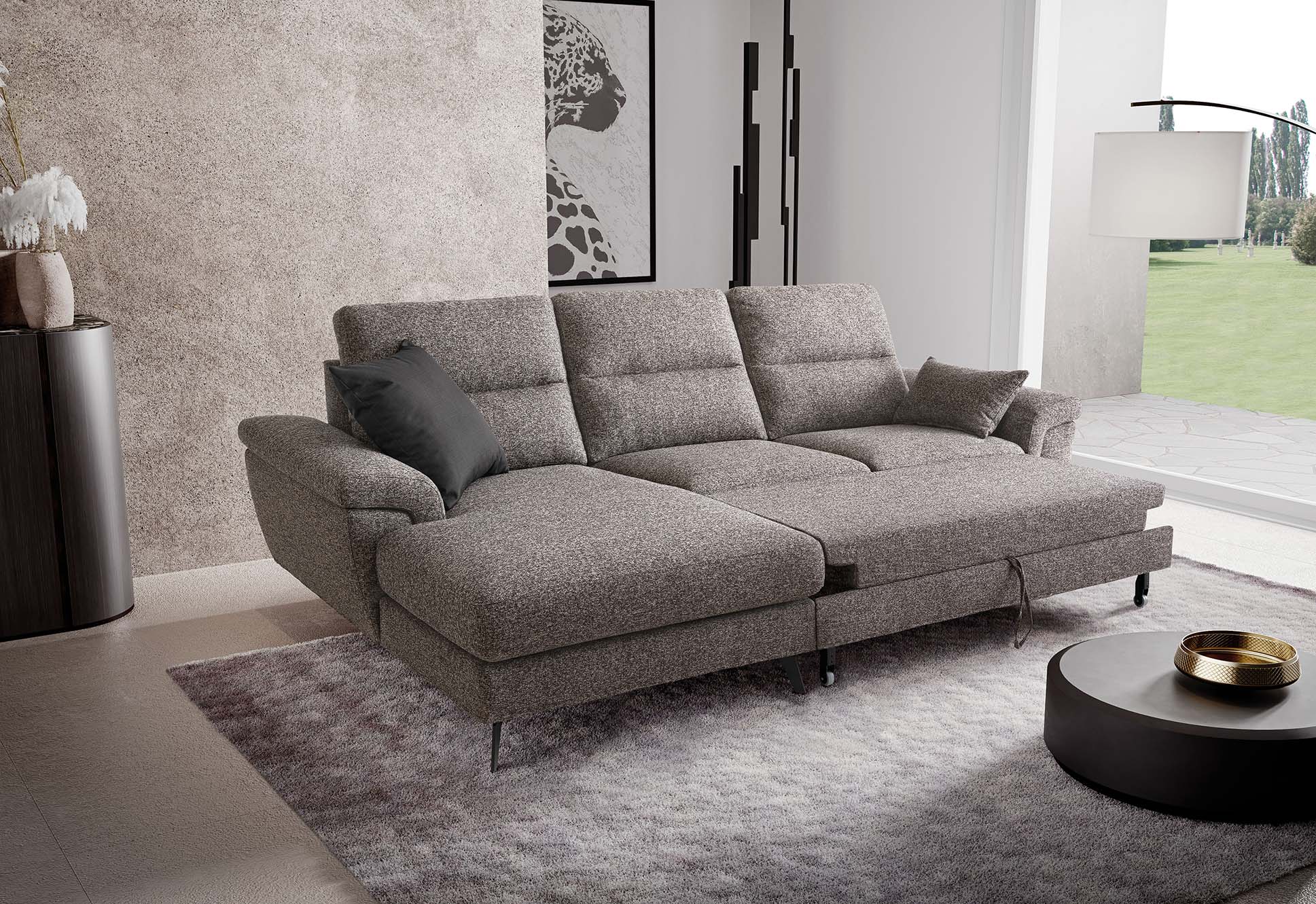 Cupido sofa with chaise longue and pull-out footrest function open to create a resting surface
