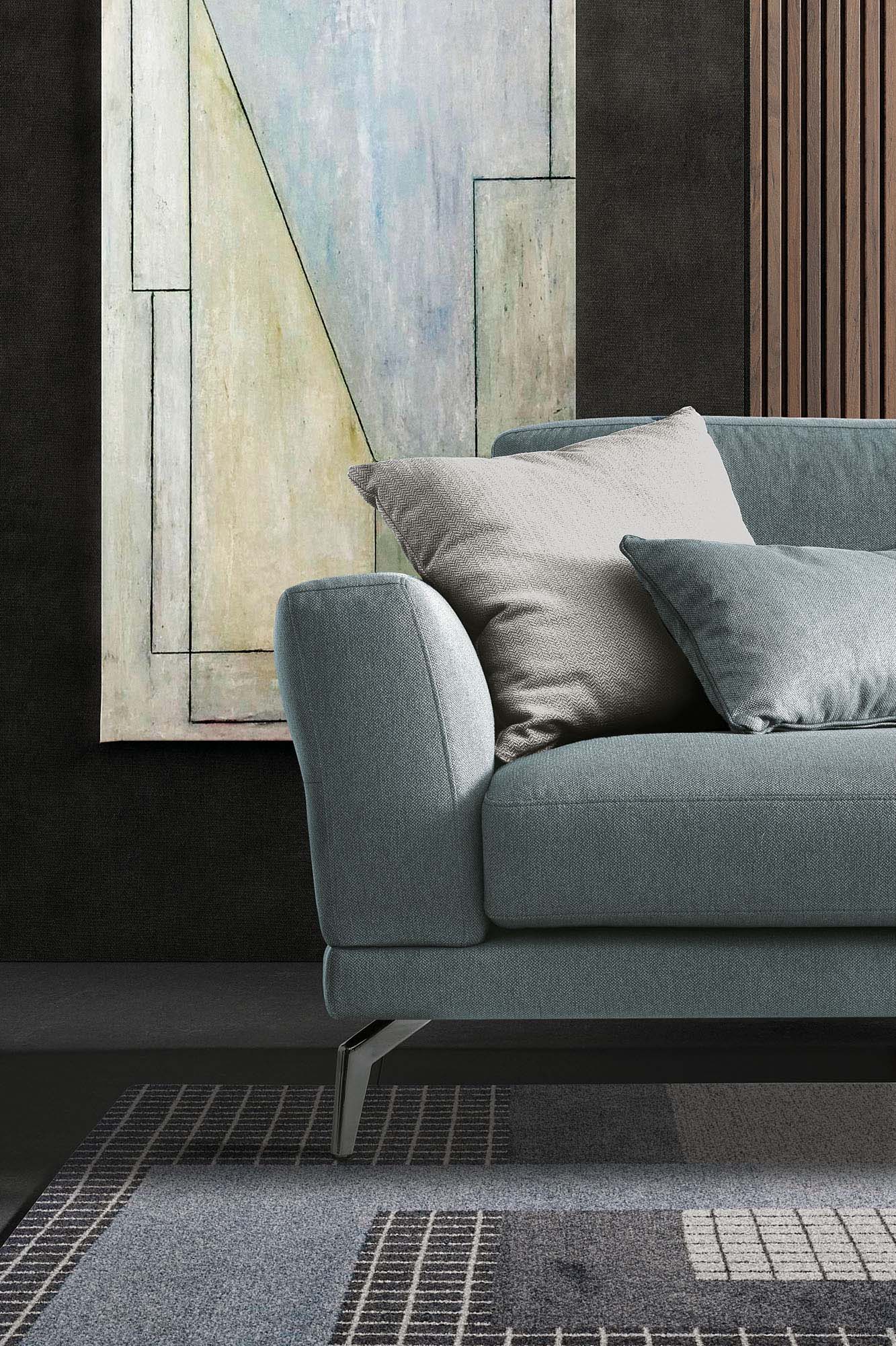 Detail of the light blue fabric seat of the Estate sofa