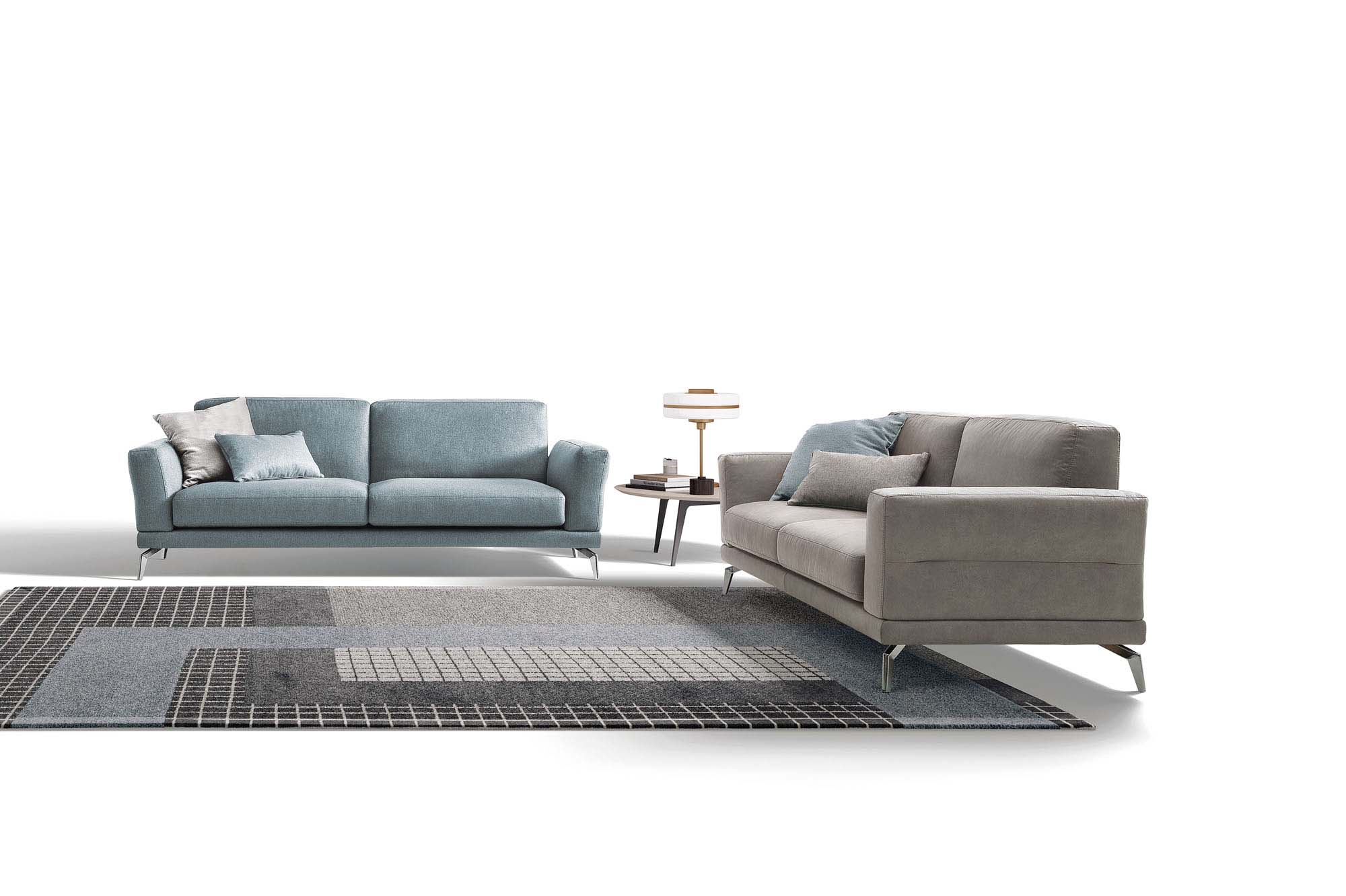 Estate sofa in silver-grey and candy blue variants with metal legs