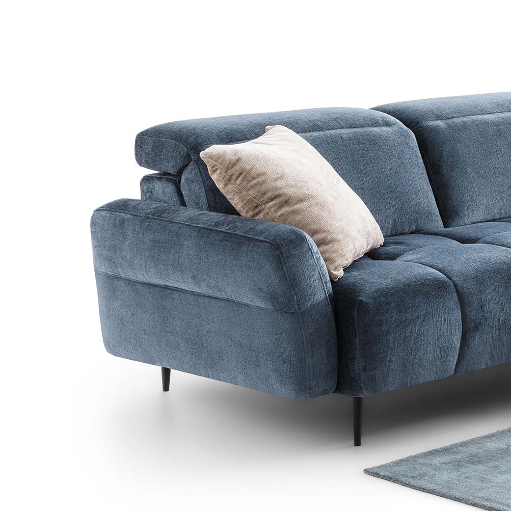 Detail of the Quilted Armrest of a Blue Velvet Sofa with High Legs