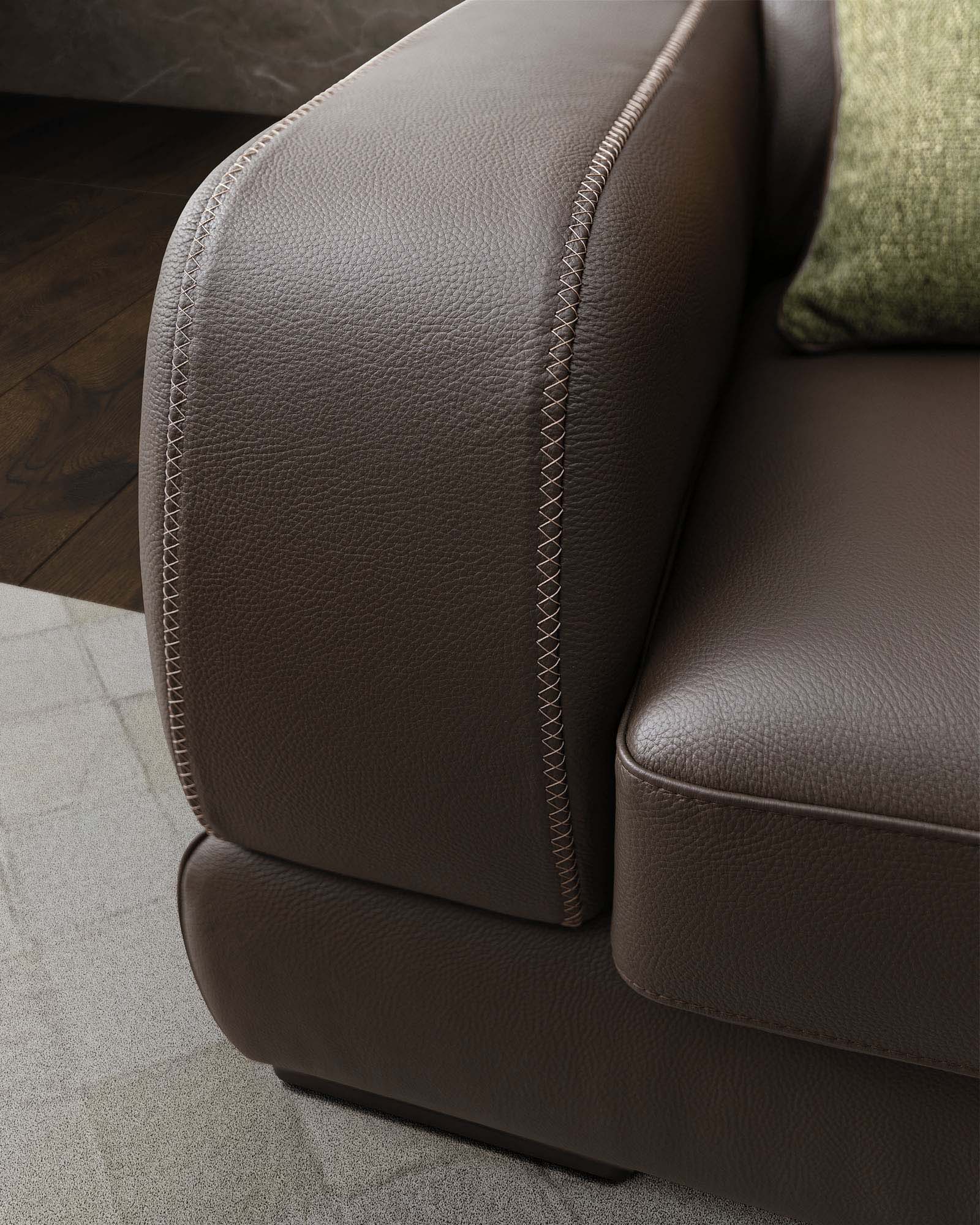 Detail of the leather armrest stitching.
