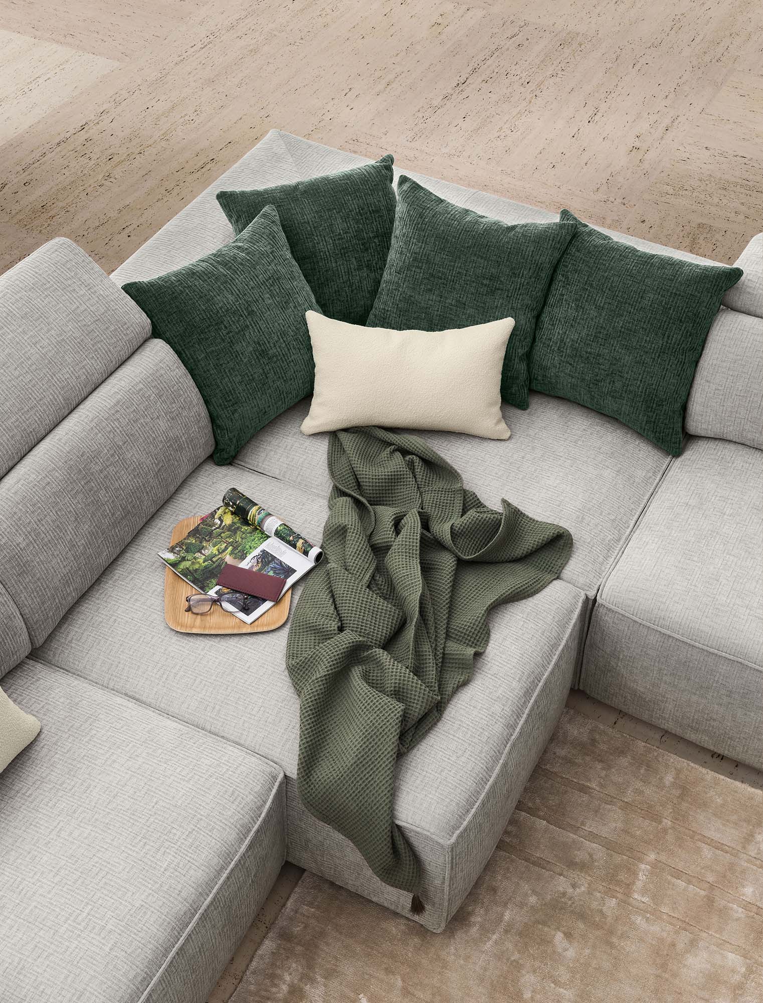 Corner of a peninsula sofa with pull-out footrest open to create a relaxation island