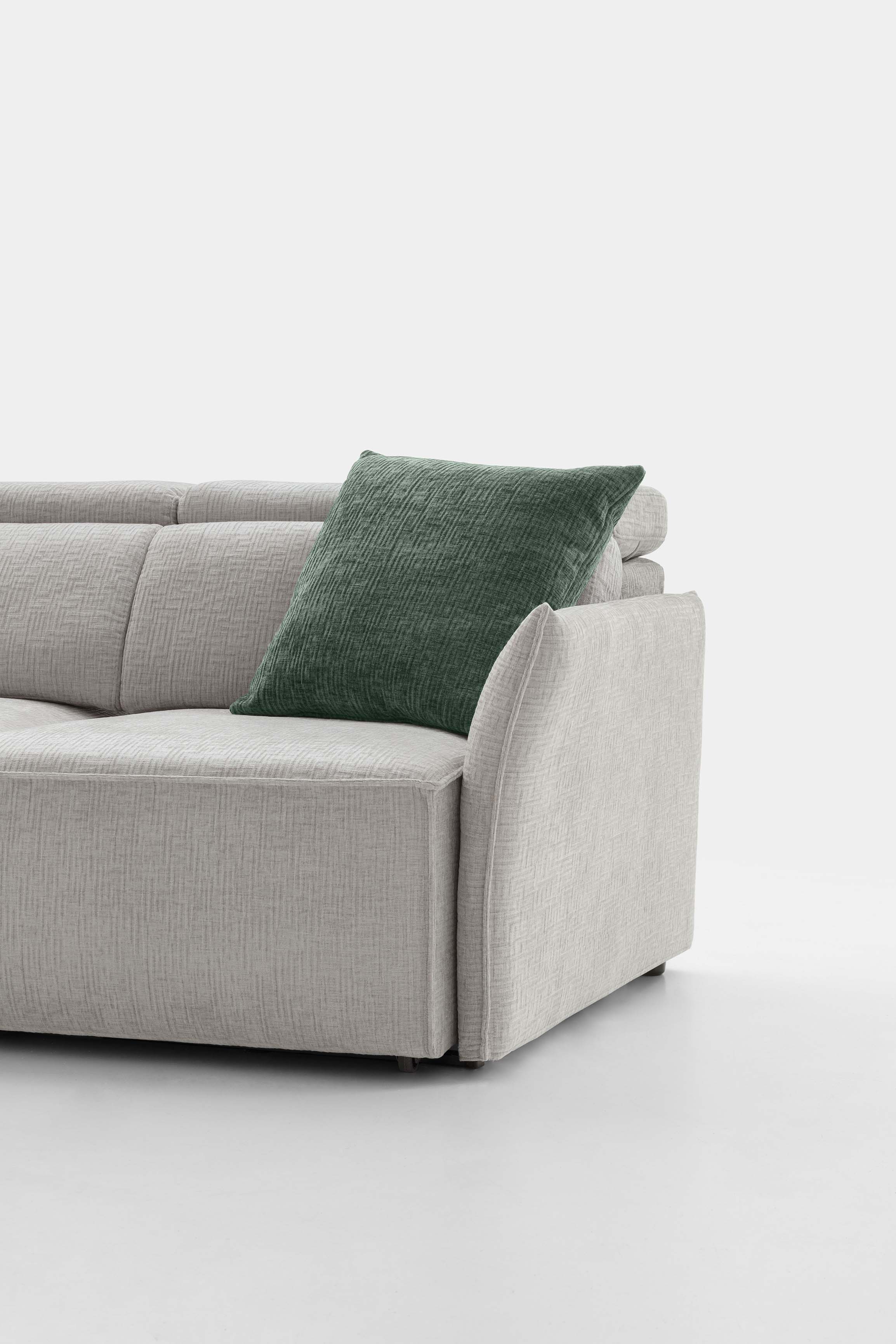 Thin and space-saving armrest for a light-colored linear sofa