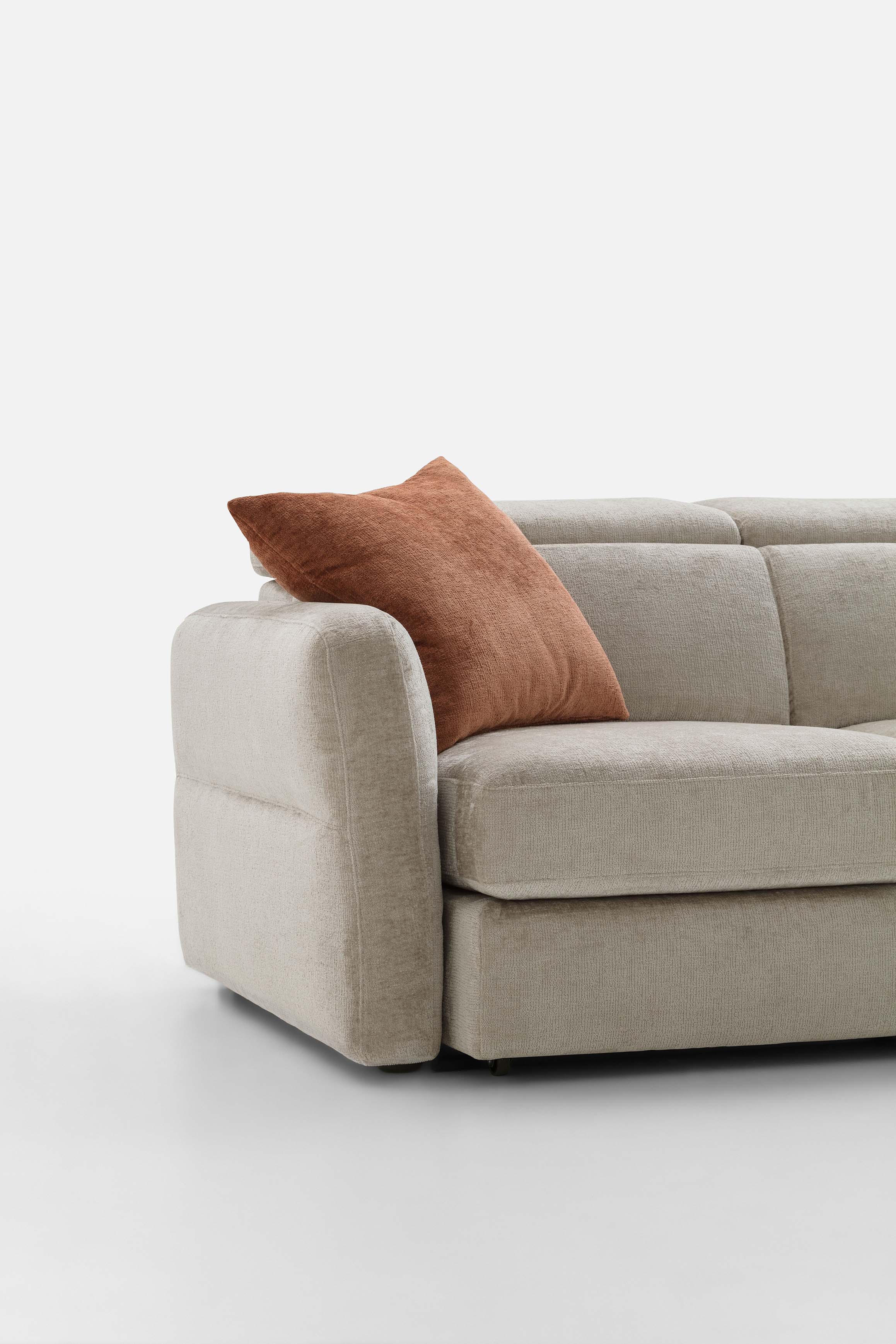 Detail of the Cio quilted armrest of a gray sofa