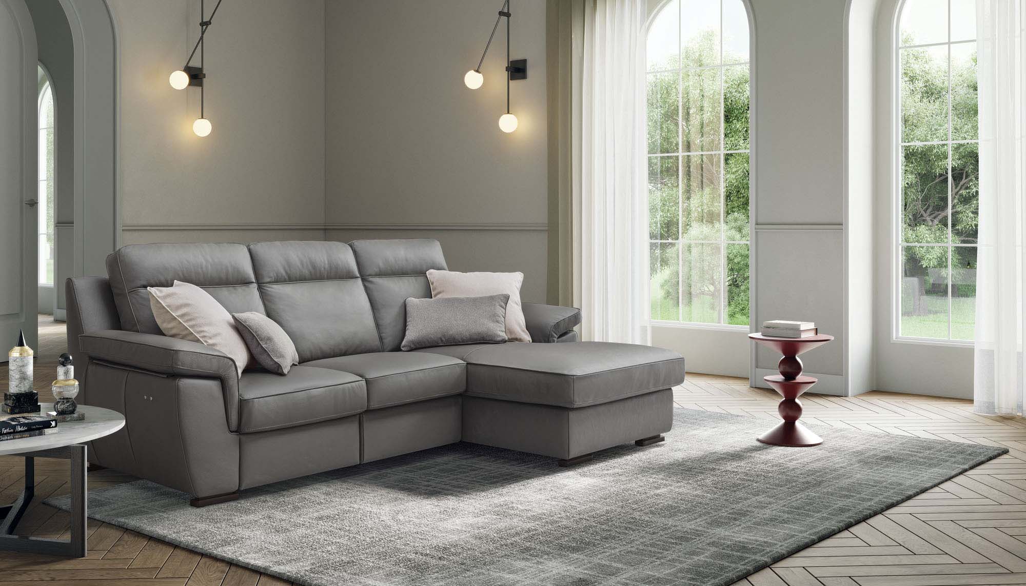 Living room furnished with a grey leather chaise longue sofa with high backrest