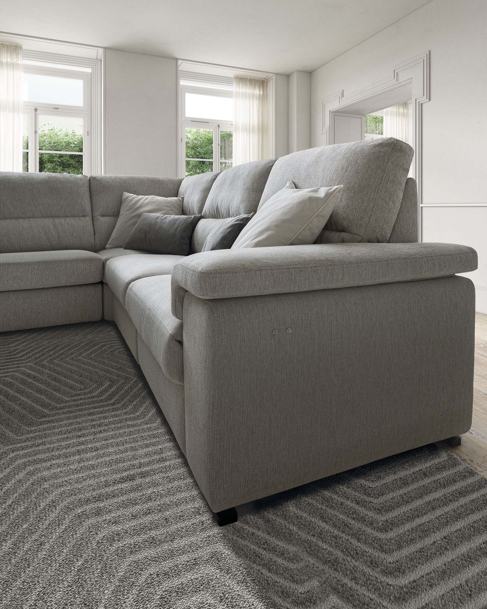 Light grey fabric corner sofa with high backrest