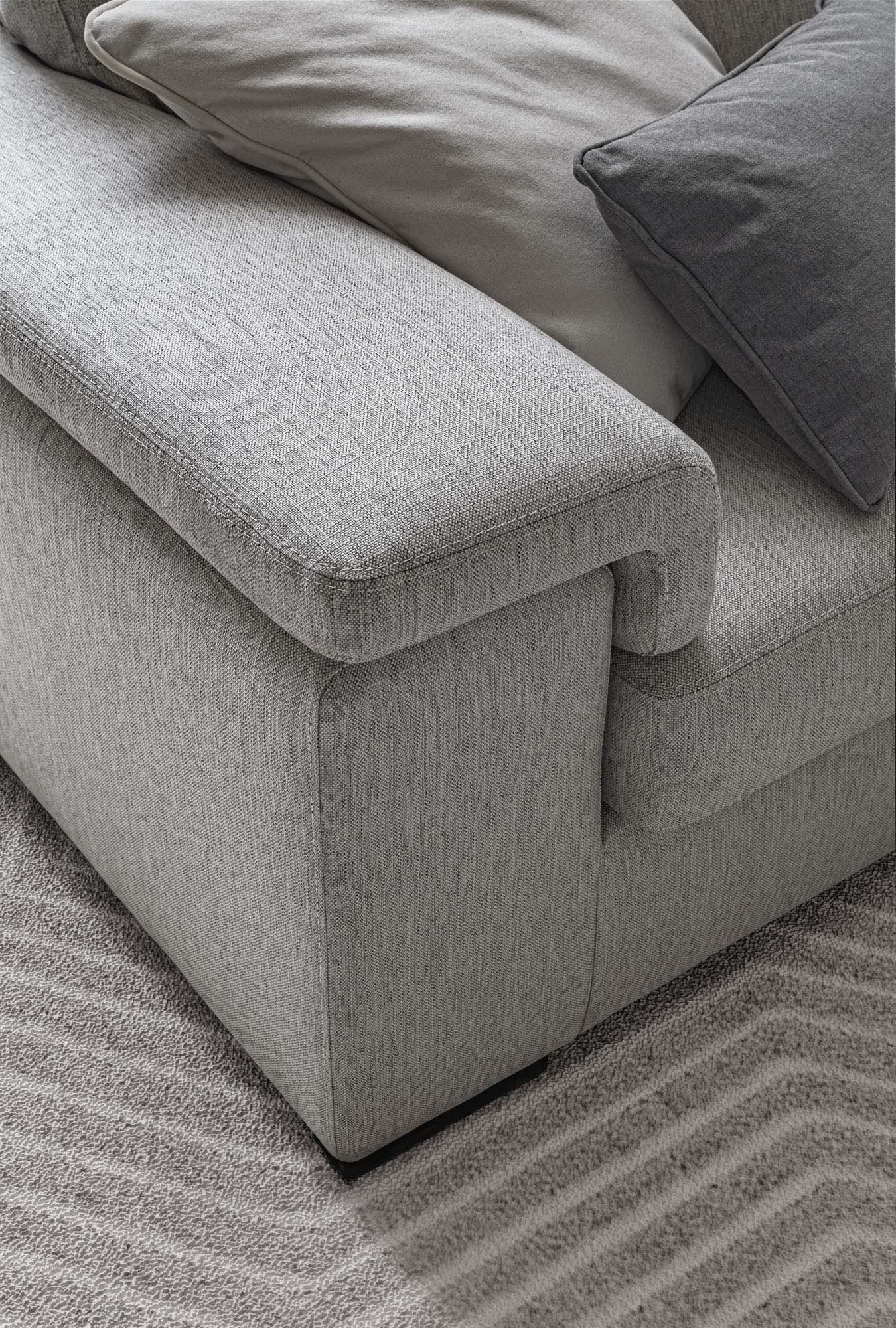 Detail of the grey fabric armrest