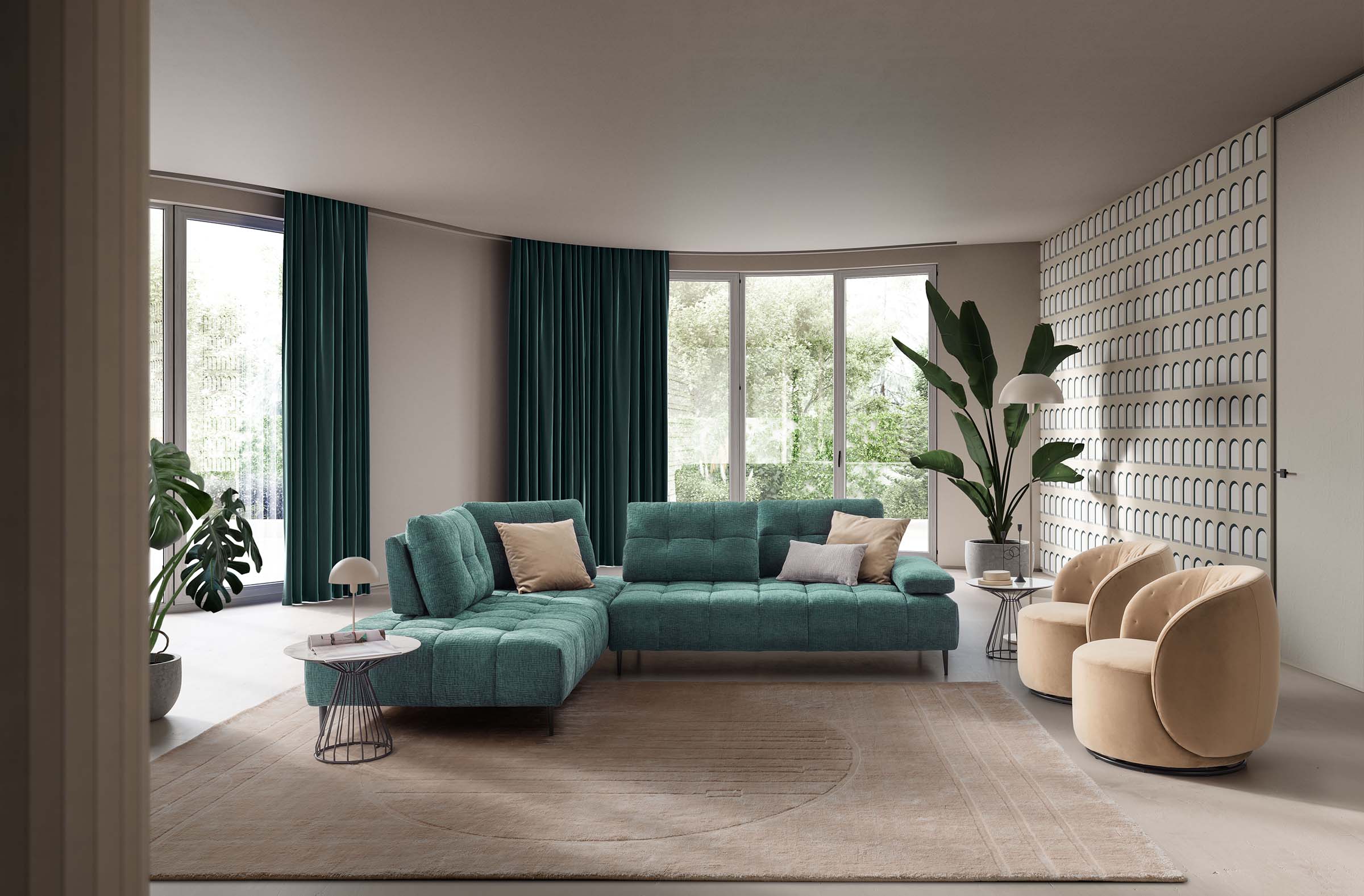 Living room composed of a green modular corner sofa and two powder pink armchairs
