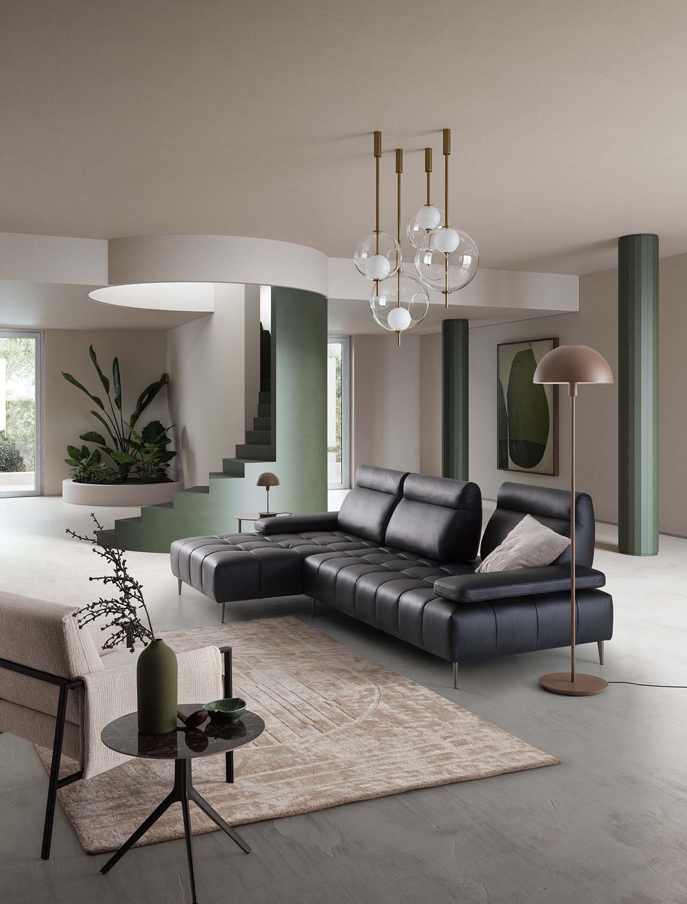 Black leather Joplin sofa with quilting on the seat and adjustable Buzz model backrest. Refined and elegant style