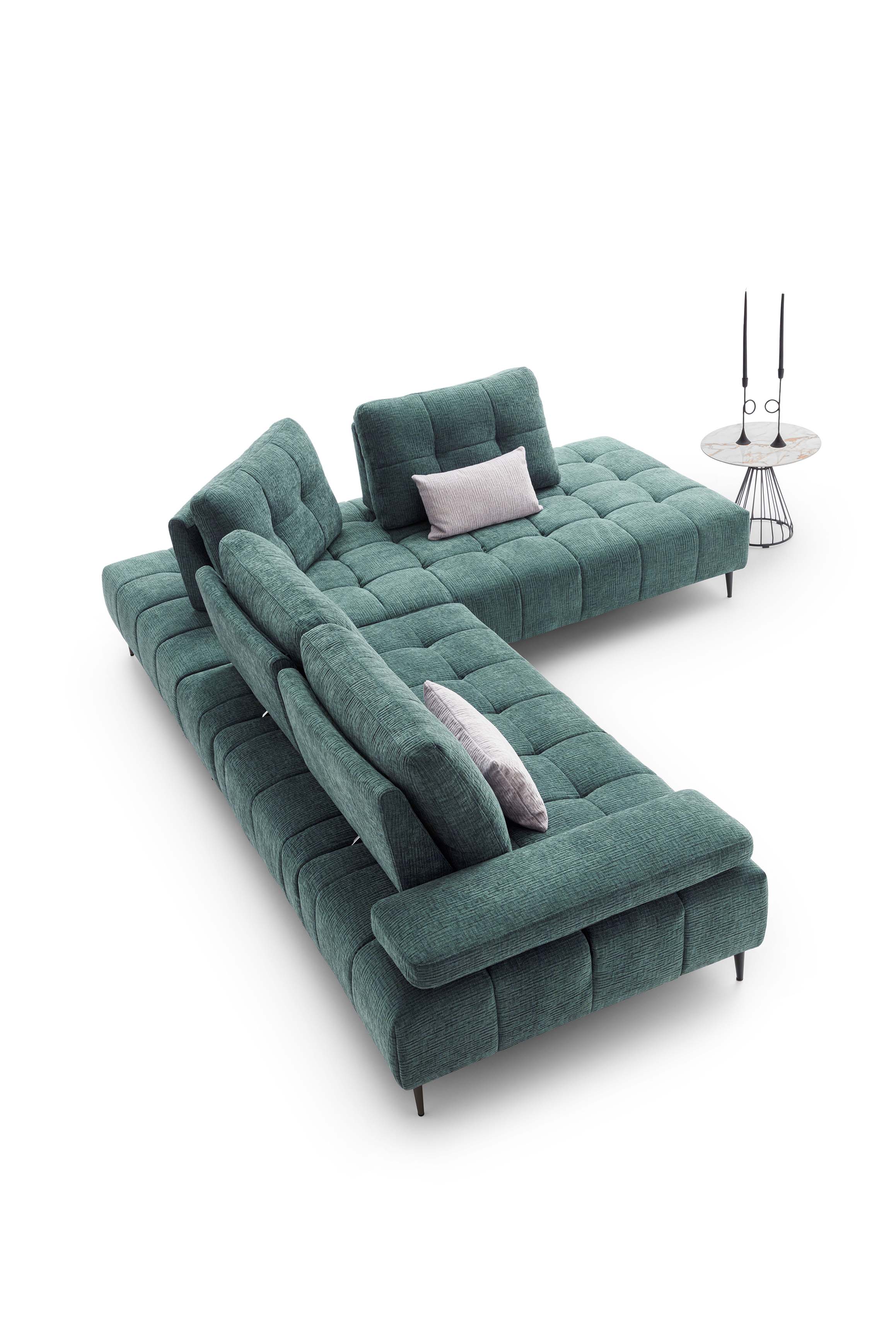 Green fabric sofa with silver cushions. Sliding backrests that modify the seat depth.