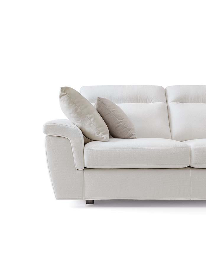 White sofa with high backrests and low feet with modern and welcoming shapes
