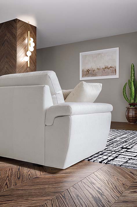 Detail of the upholstered and rounded side armrest