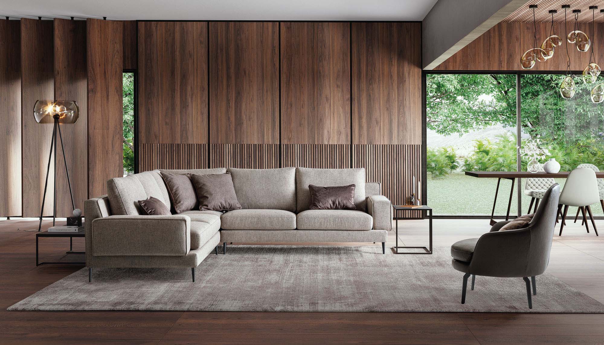 Spacious living room furnished with a designer corner sofa with thin legs