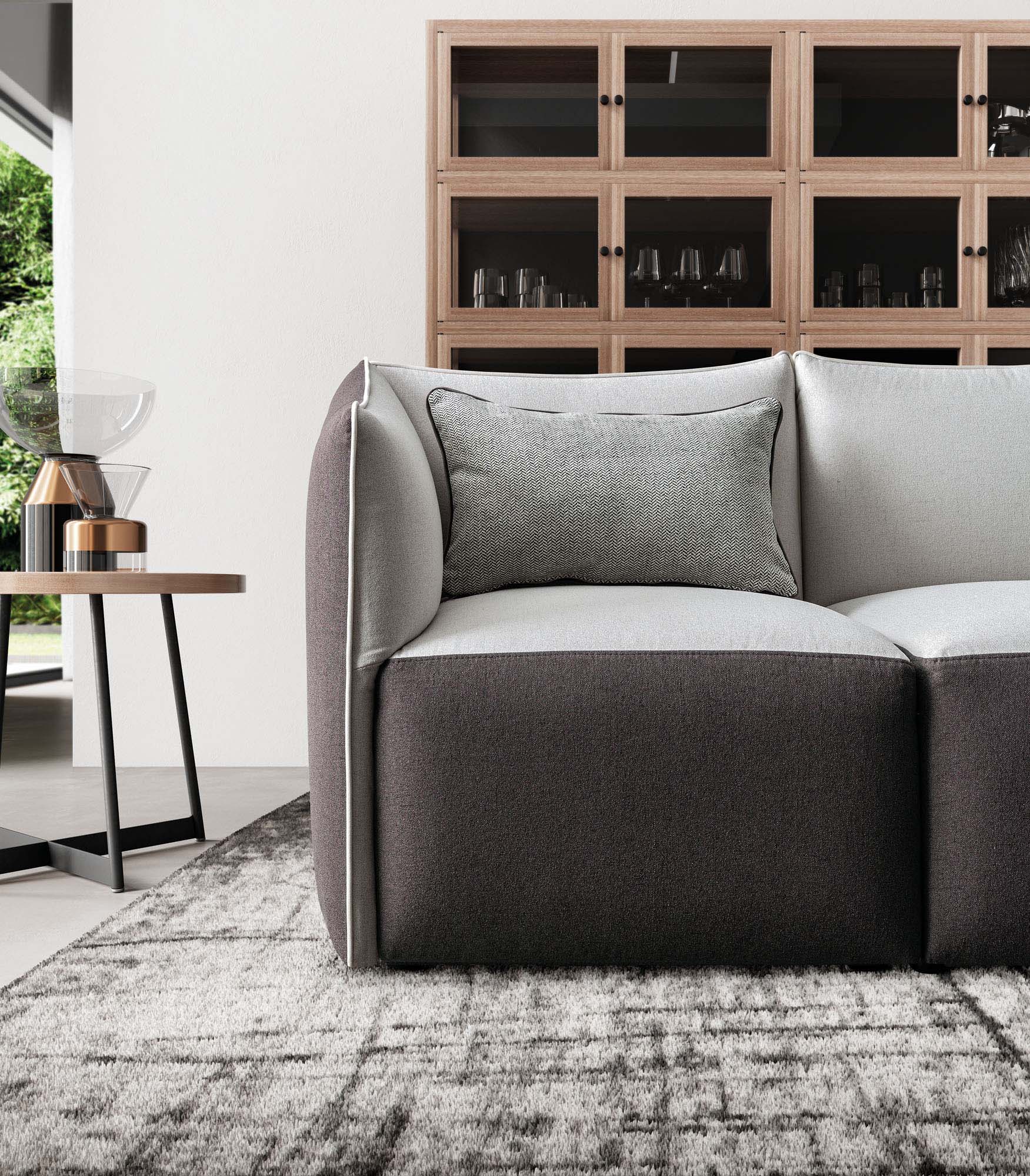 Seat detail of a two-tone white and grey sofa with removable coverings