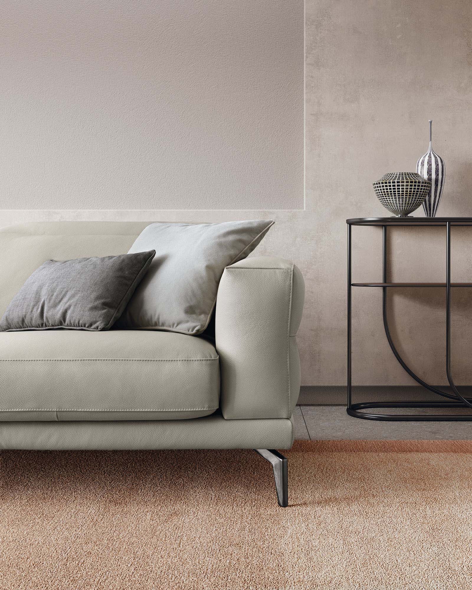 Detail of the leather armrest and modern legs