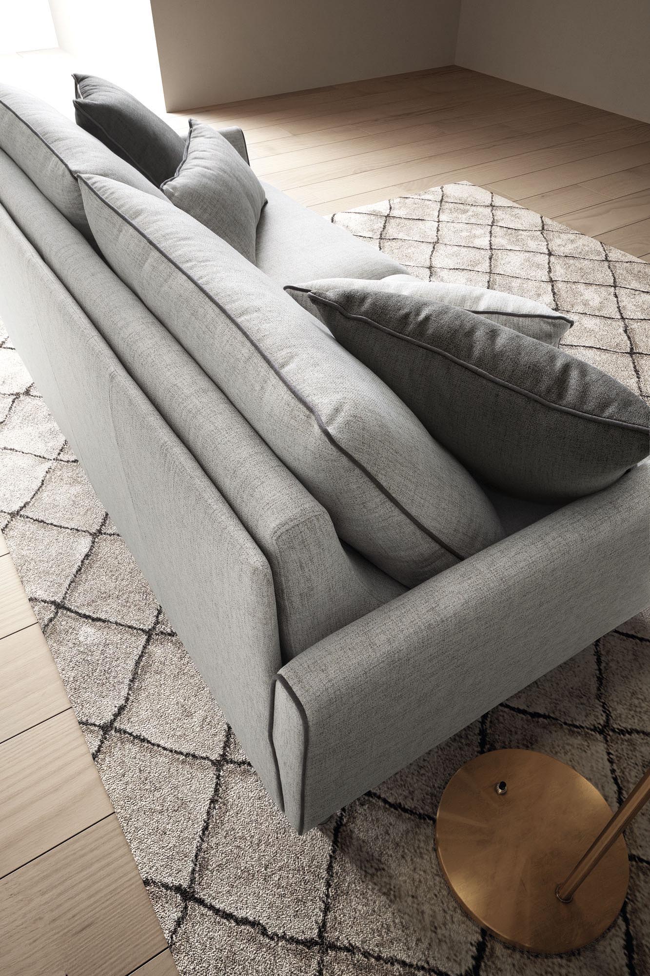 Detail of the Bali sofa bed backrest: rigid backrest with two large support cushions and other decorative cushions