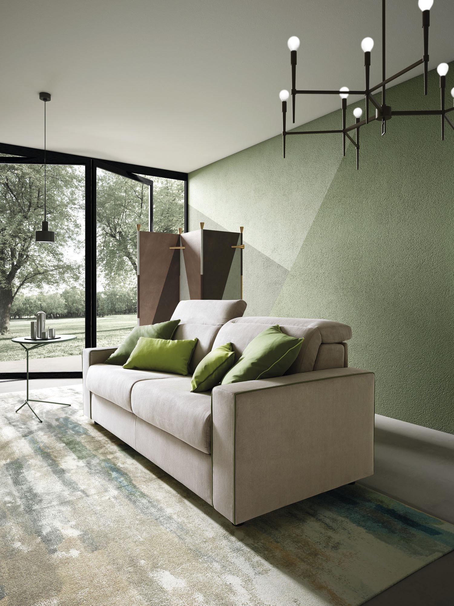 Modern sofa with squared armrests and adjustable headrests embellished with contrasting green edging