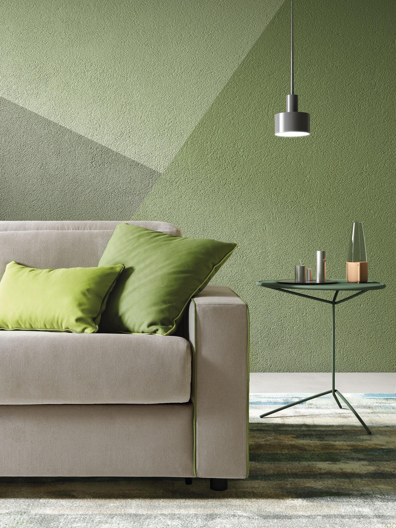 Detail of the seat of a gray sofa with adjustable headrests and a matching coffee table