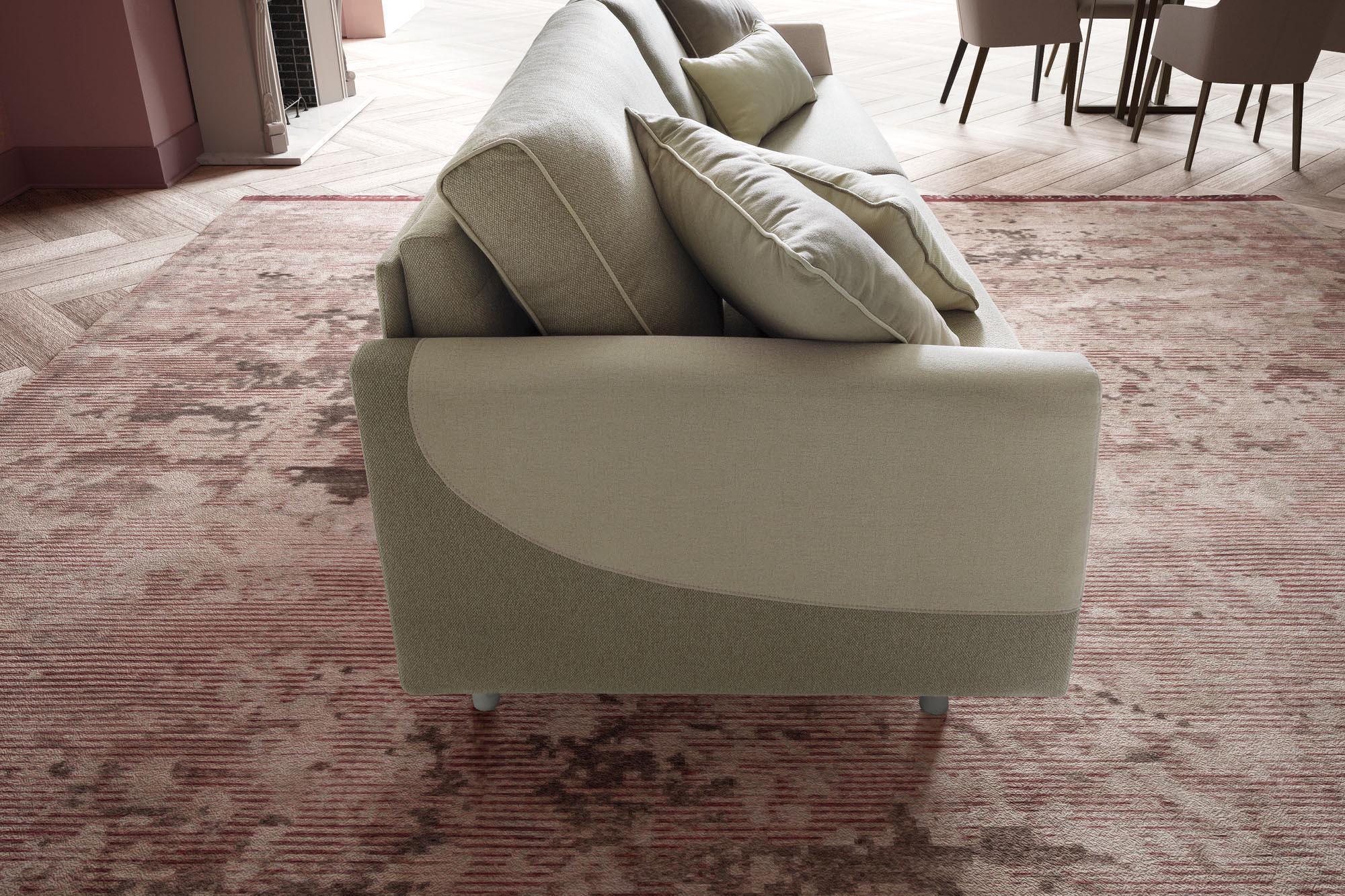 Side view of a two-seater sofa with edging on the cushions and two-tone armrest