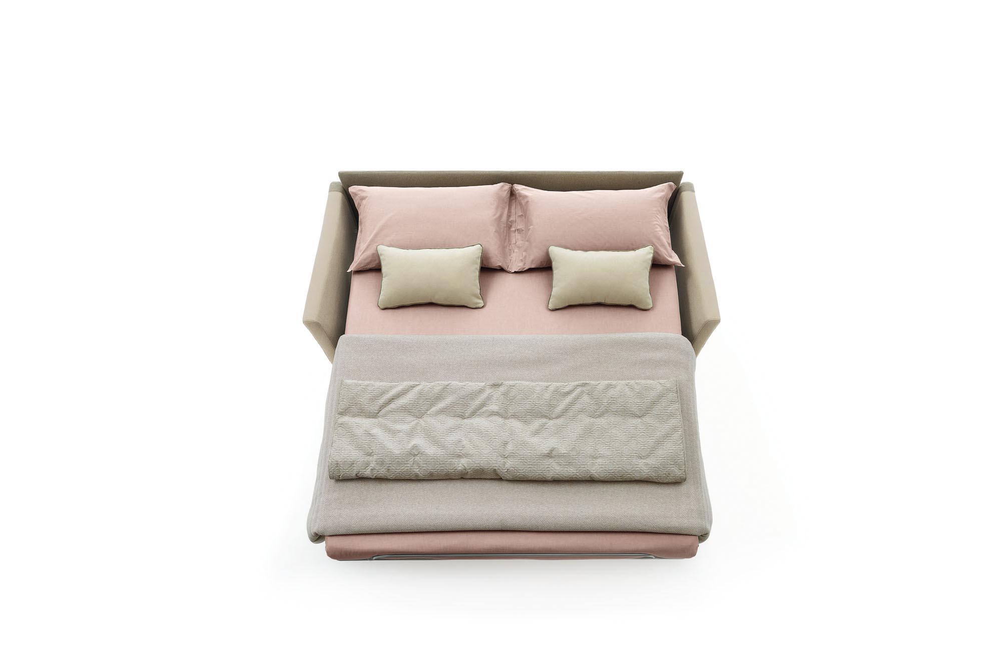 Maldive sofa bed opened and prepared with sheets, blankets and pillows