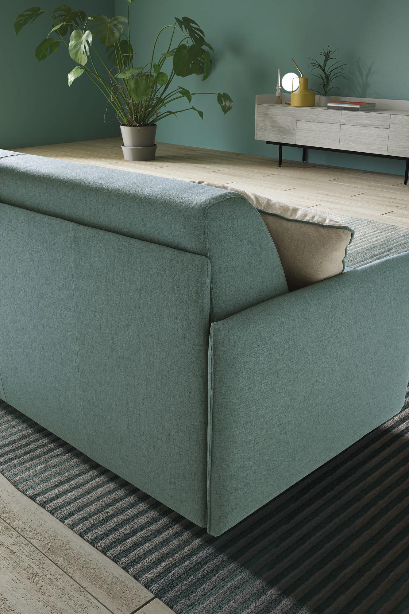 Detail of the back of the Naxos sofa with super thin and space-saving backrest and armrests