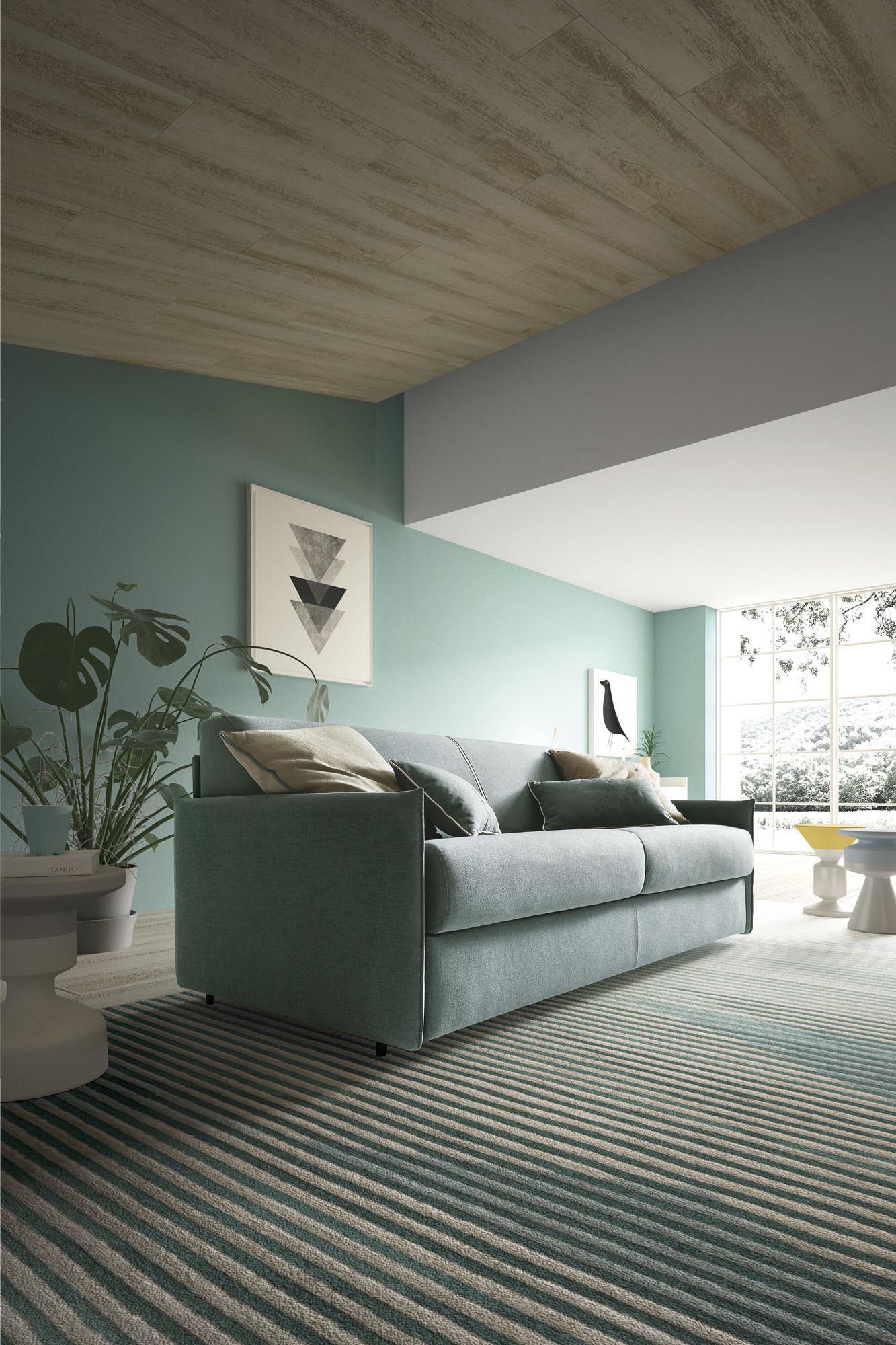 Sofa convertible into bed upholstered in removable light blue fabric. Modern style