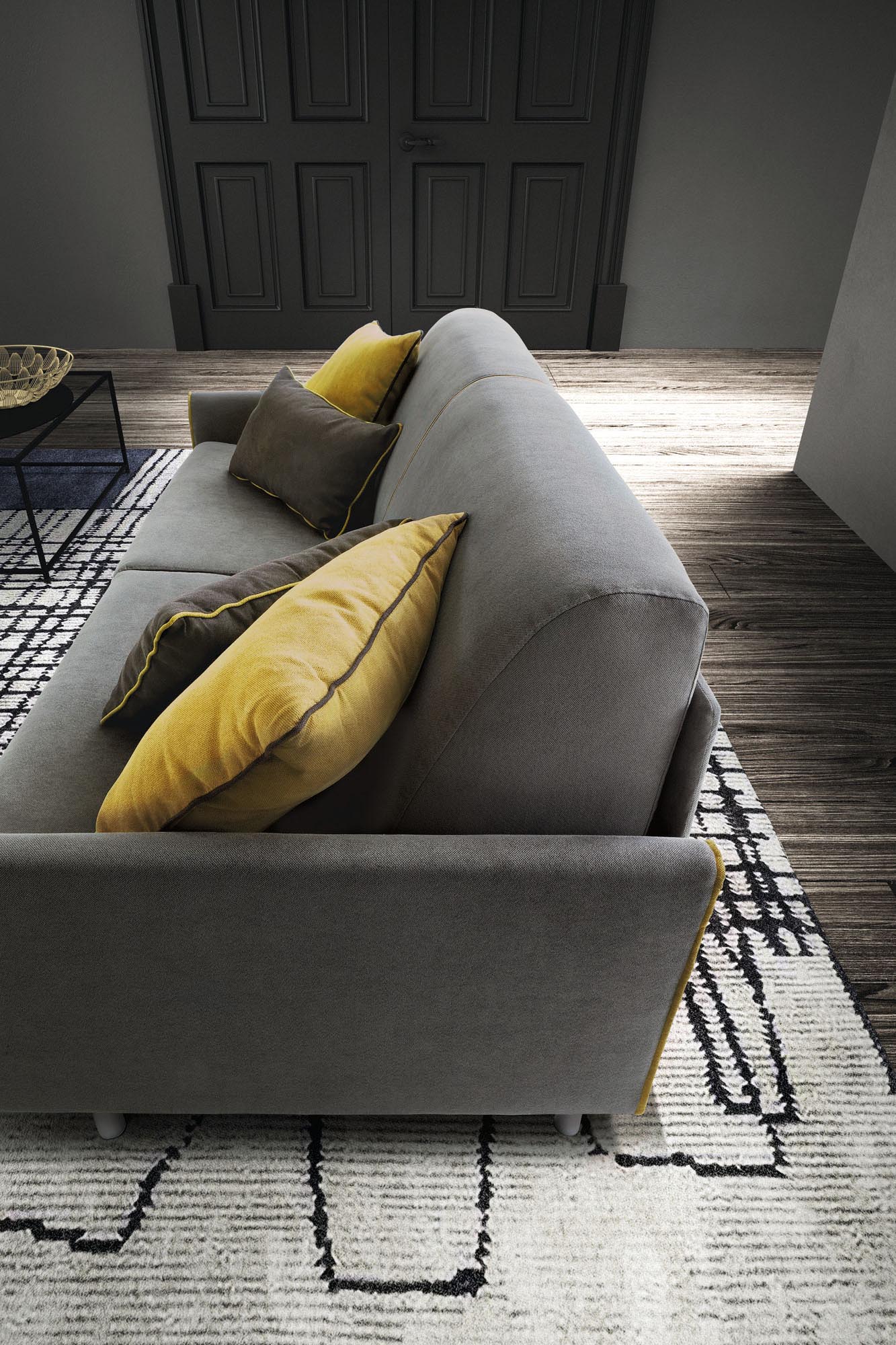Side view of a closed sofa bed with slim backrest and armrest