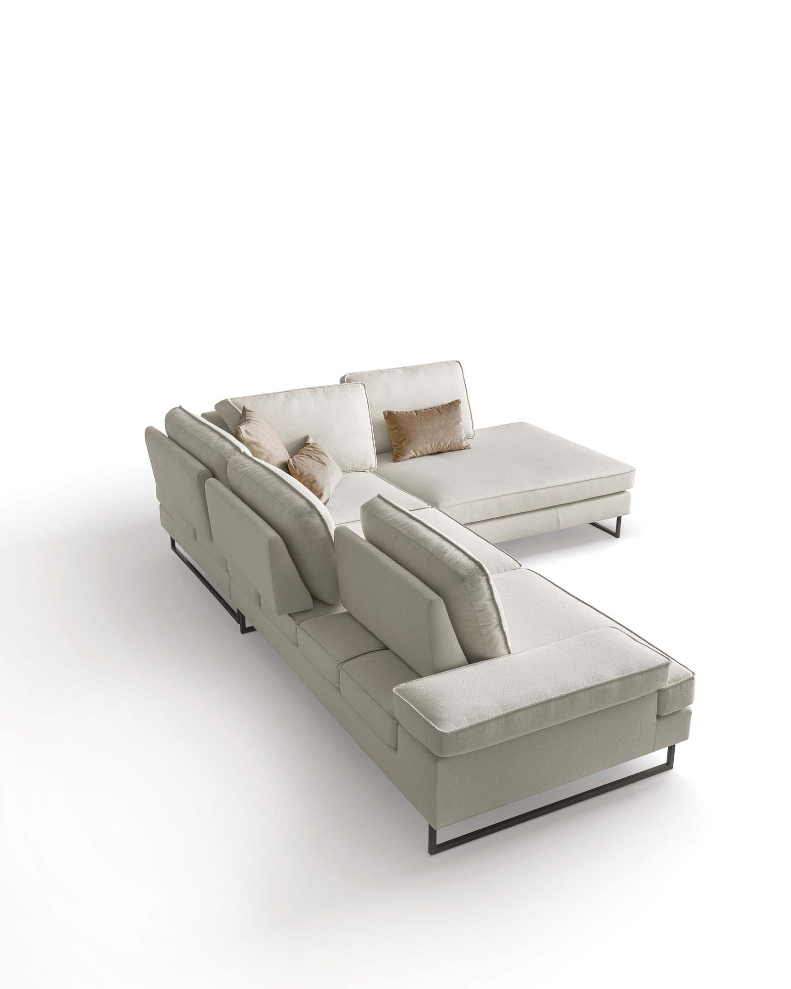 White sofa with sliding backrest and designer legs