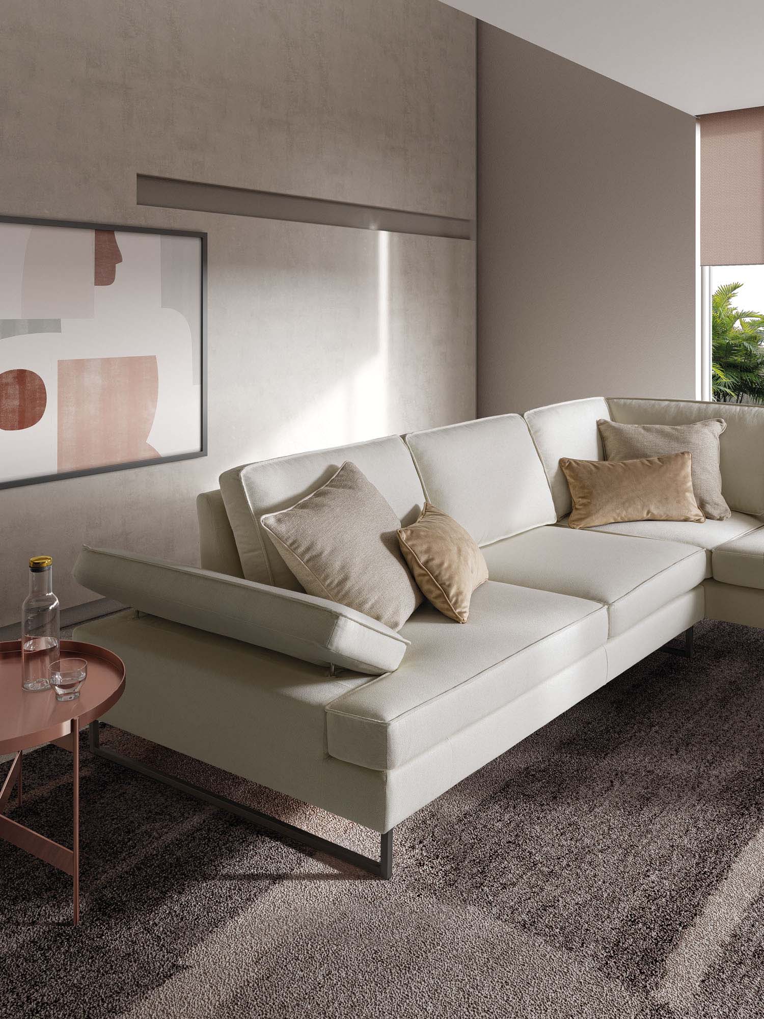 Large white sofa with adjustable armrest and removable and washable covering