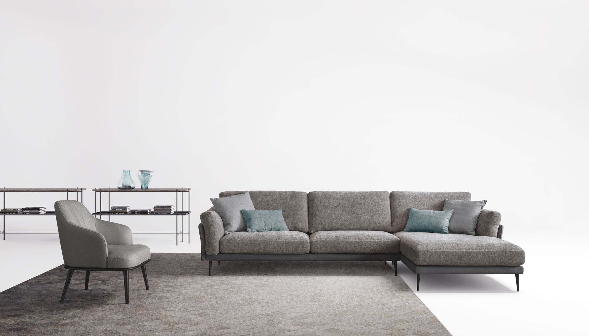 Taupe grey modular sofa with chaise longue, with matching cushions, armchair and rug.