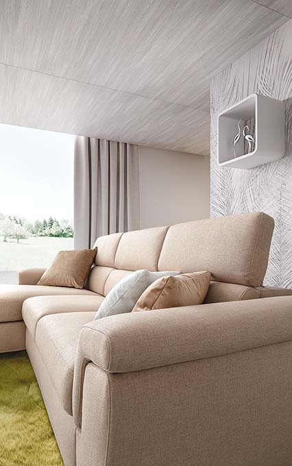 Sofa with cream-colored upholstery with all headrests extended