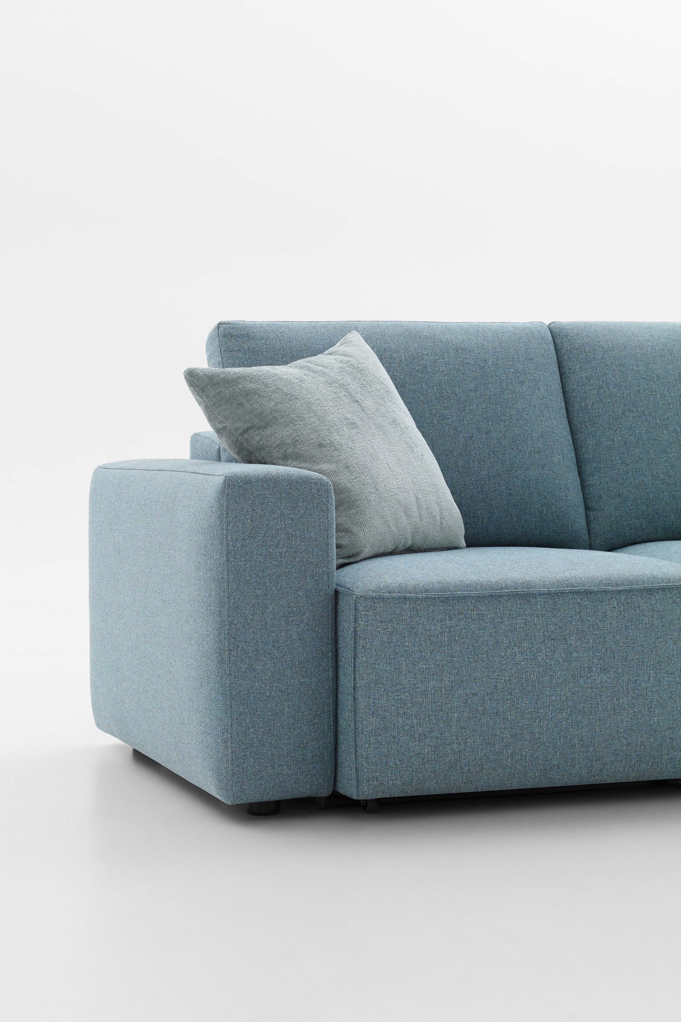 Detail of the Bai armrest applied to a light blue Soho monocoque sofa