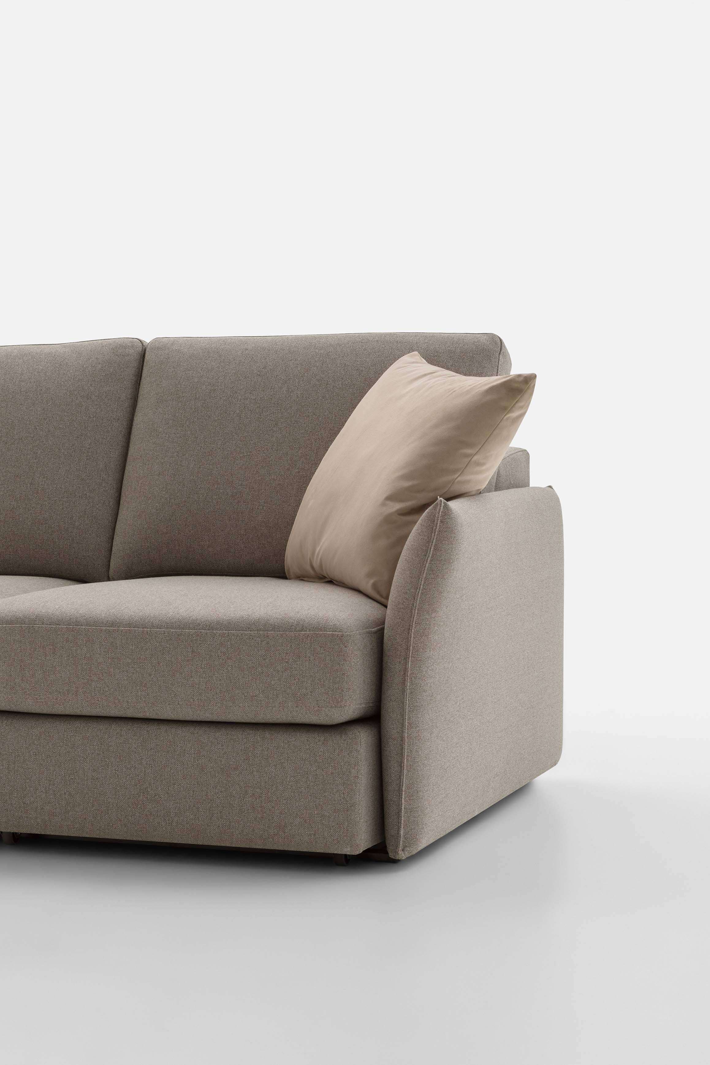 Detail of a space-saving linear sofa with a slender but robust 'Drai' model armrest