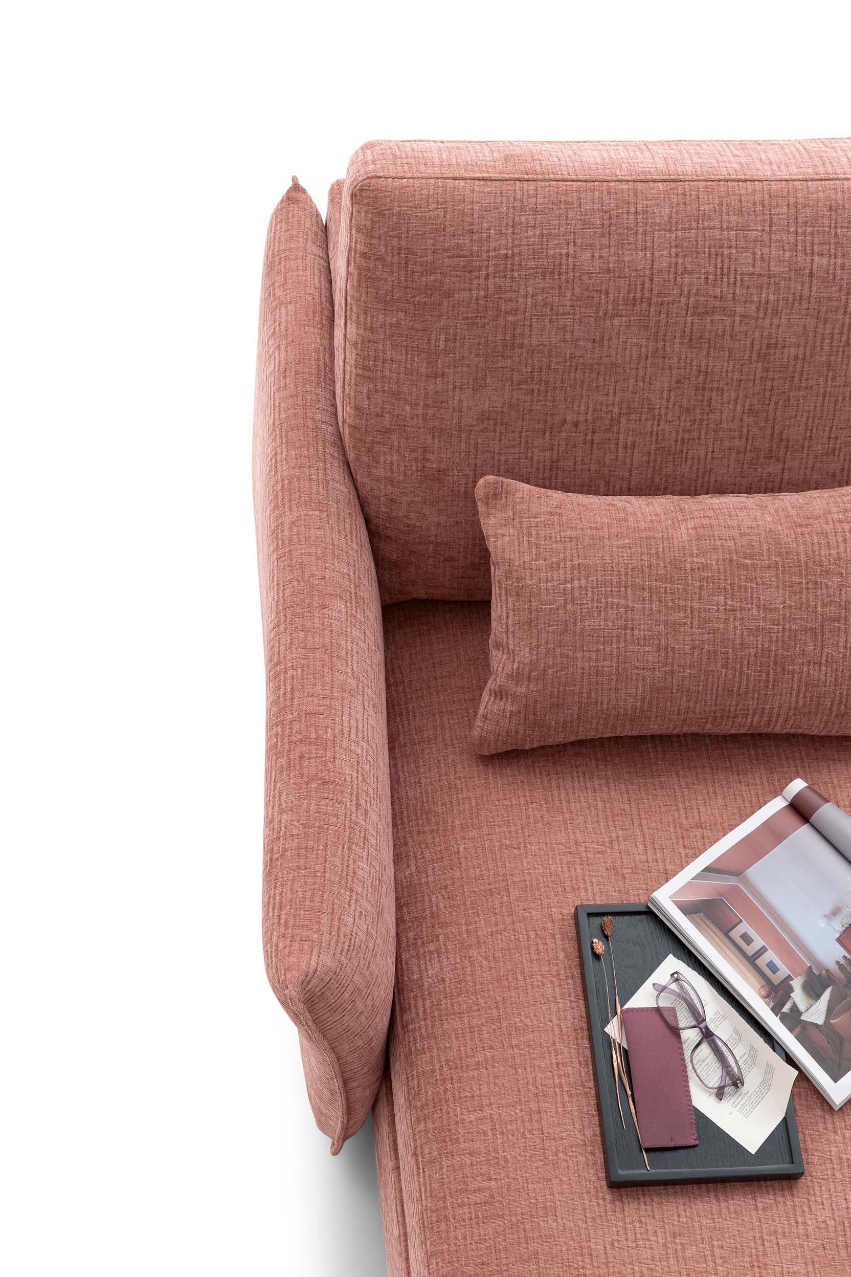 Detail of the armrest of a red Soho Double LeComfort sofa, thin, seen from above
