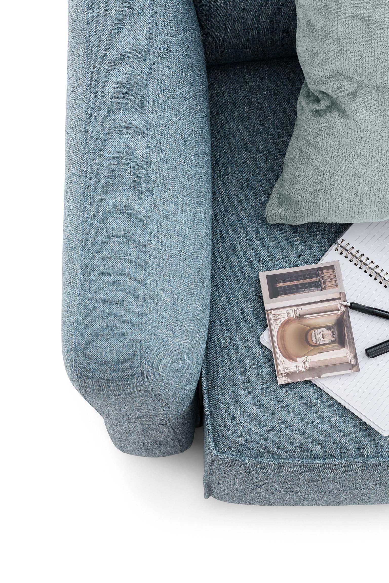 Top-down detail of the Cio armrest of the light blue Soho sofa
